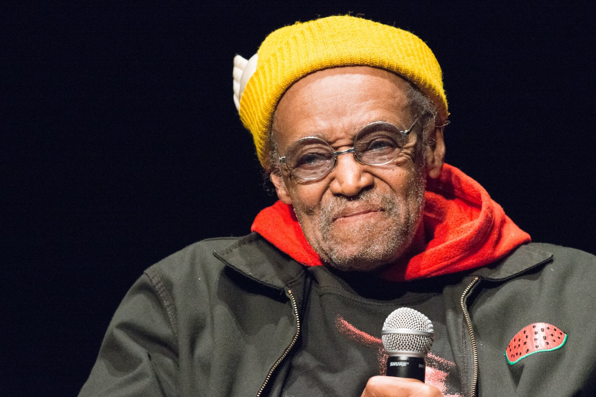 Melvin Van Peebles speaks during the 6th Annual Queens World Film Festival wearing a yellow beanie
