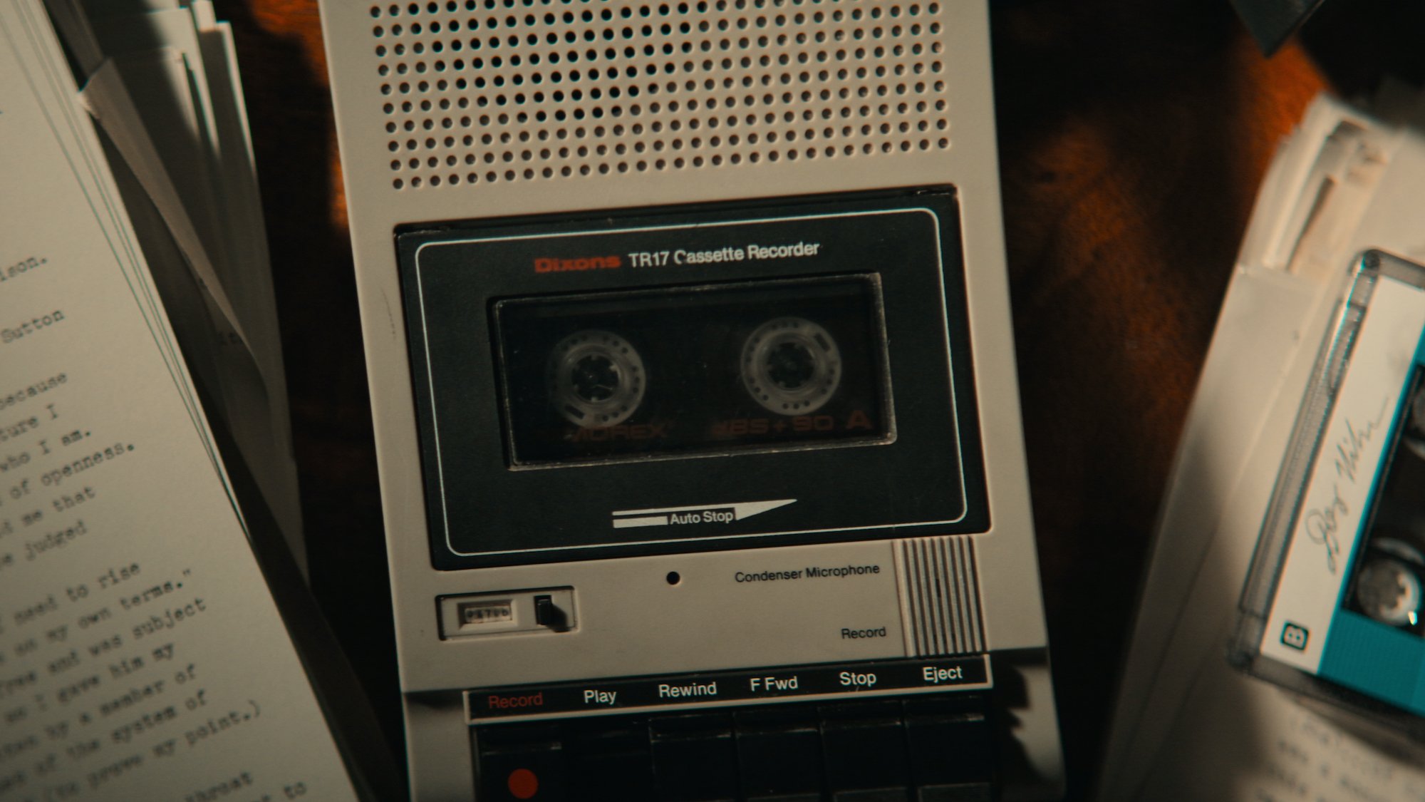 A casette recorder on a desk in a promotional photo for 'Memories of a Murderer: The Nilsen Tapes'