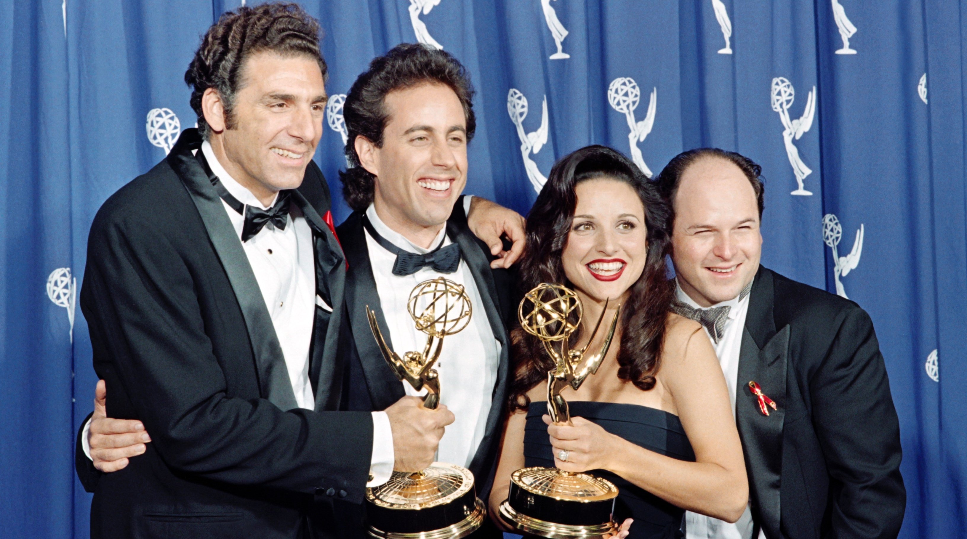 Michale Richards, Jerry Seinfeld, Julia Louise-Dreyfus and Jason Alexander 'Seinfeld' in black tie holding Emmy