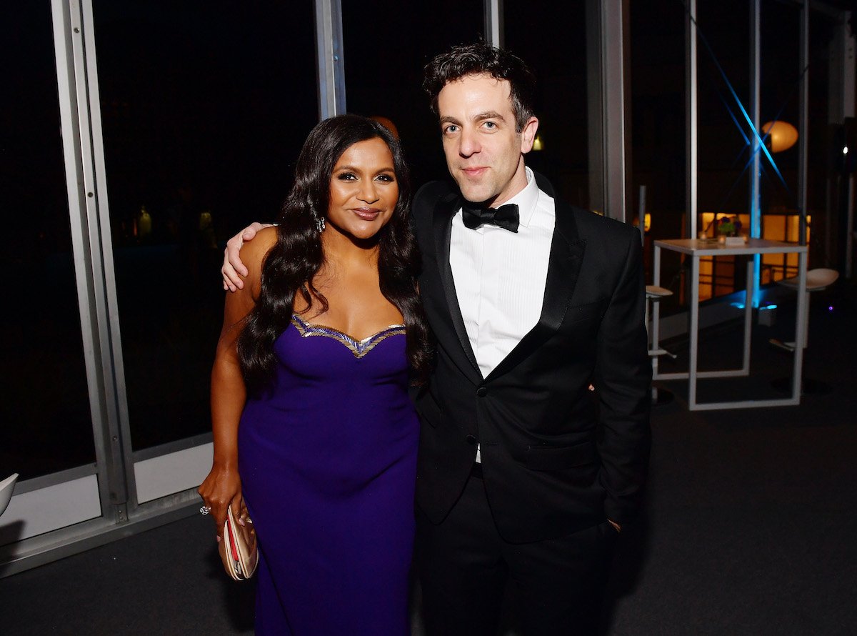 Mindy Kaling and B.J. Novak embrace at the Vanity Fair Oscar Party