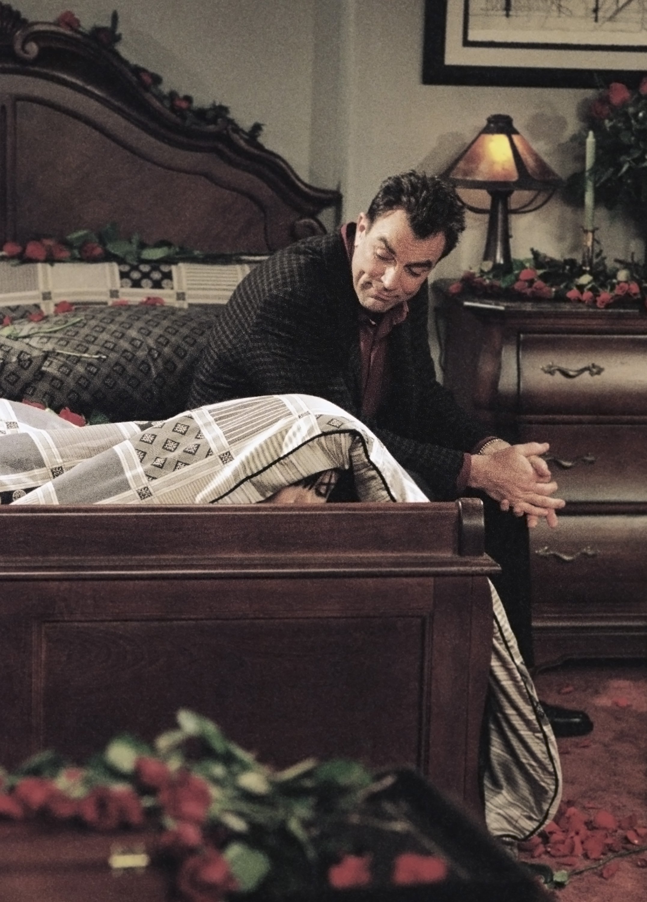 Dr. Richard Burke comforts Monica Geller in his bedroom during an episode of 'Friends'