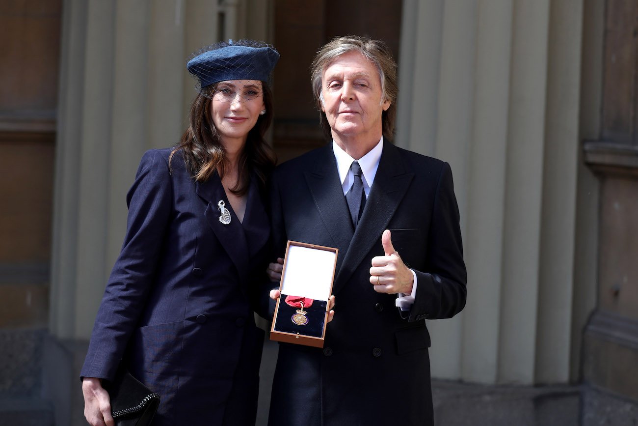Nancy Shevell and Paul McCartney after an Investiture ceremony. 