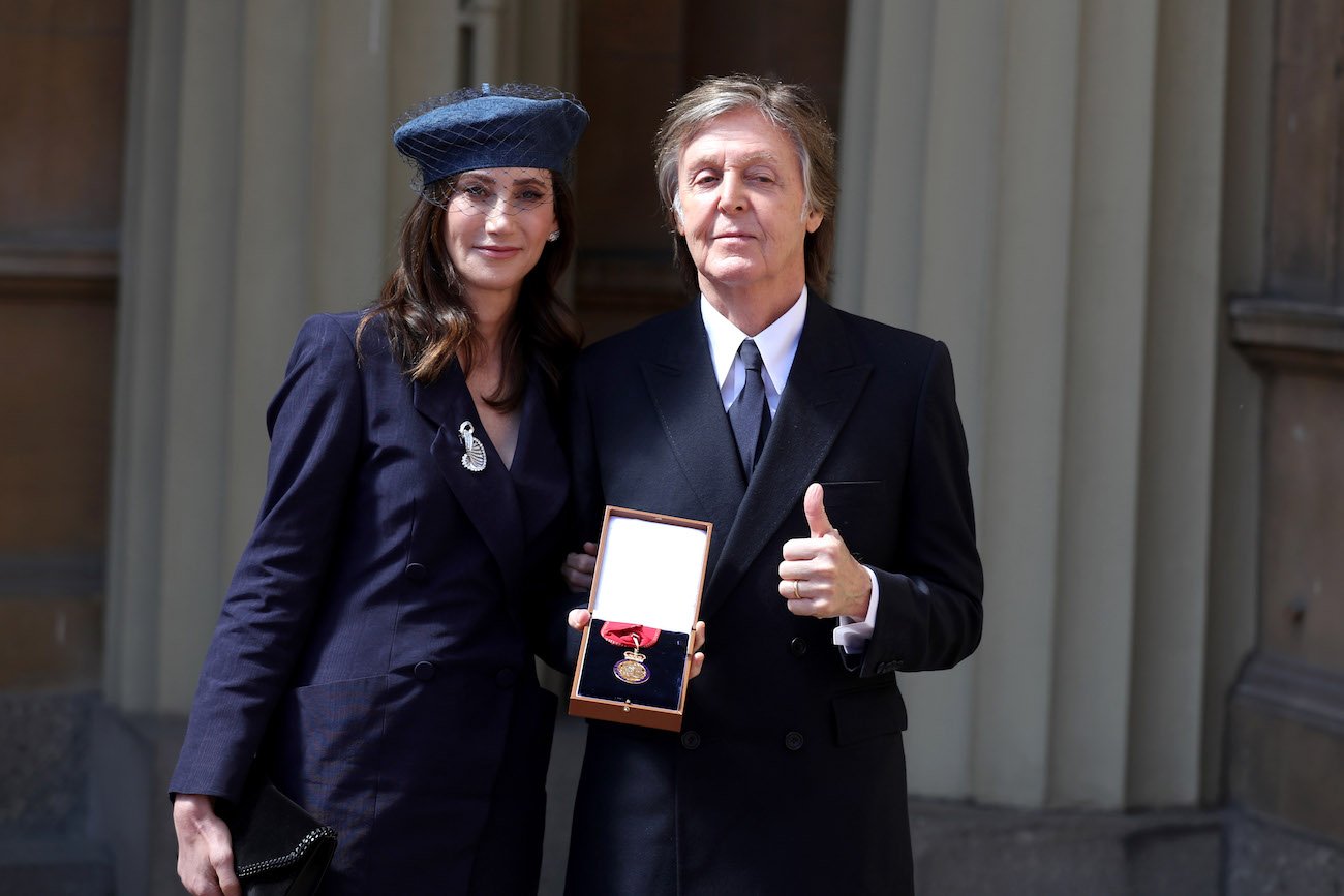 Nancy Shevell and Paul McCartney after an Investiture ceremony.