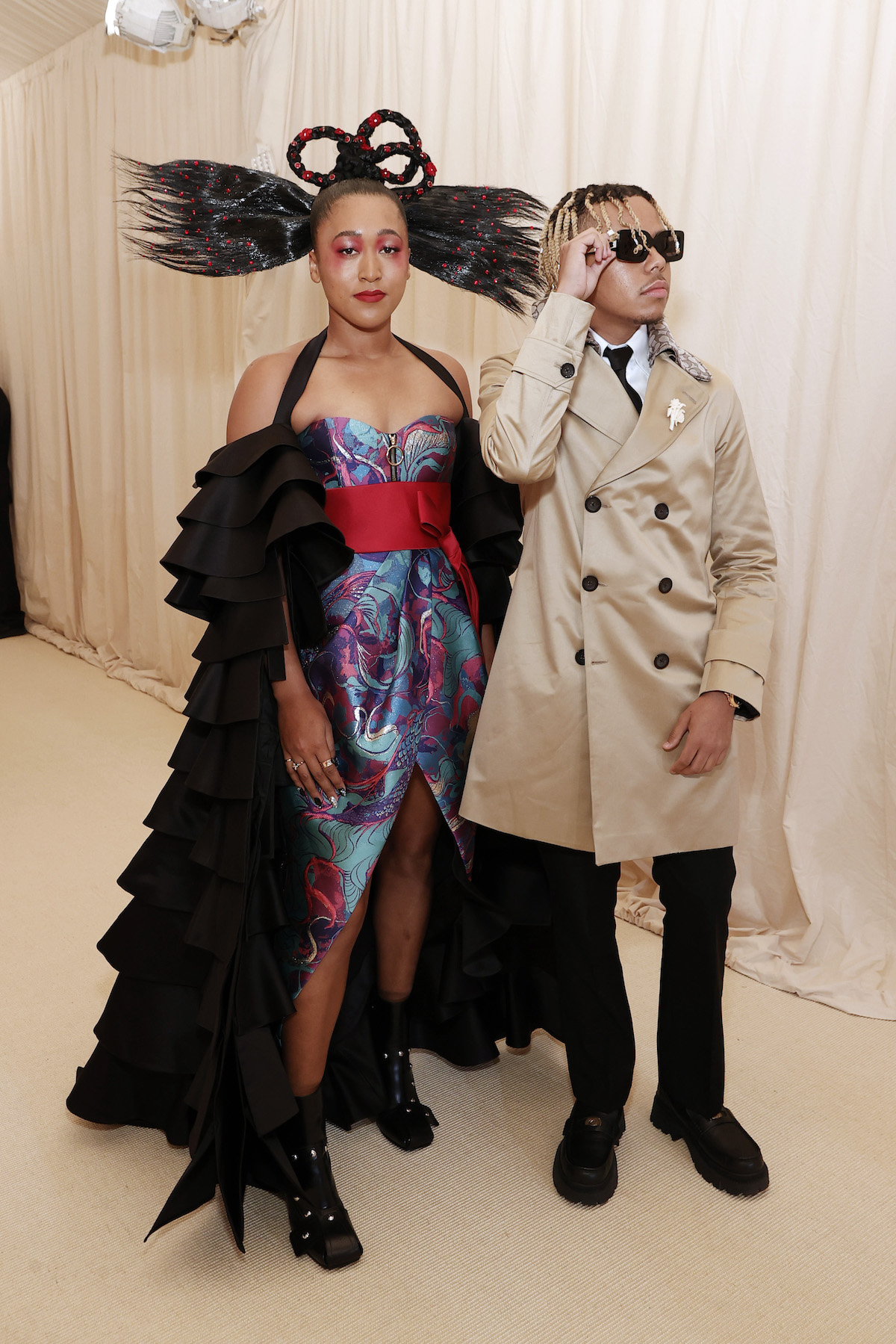 Naomi Osaka and Cordae Dunston pose for cameras at the 2021 Met Gala