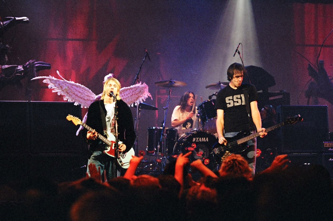 Members of Nirvana on the stage performing.