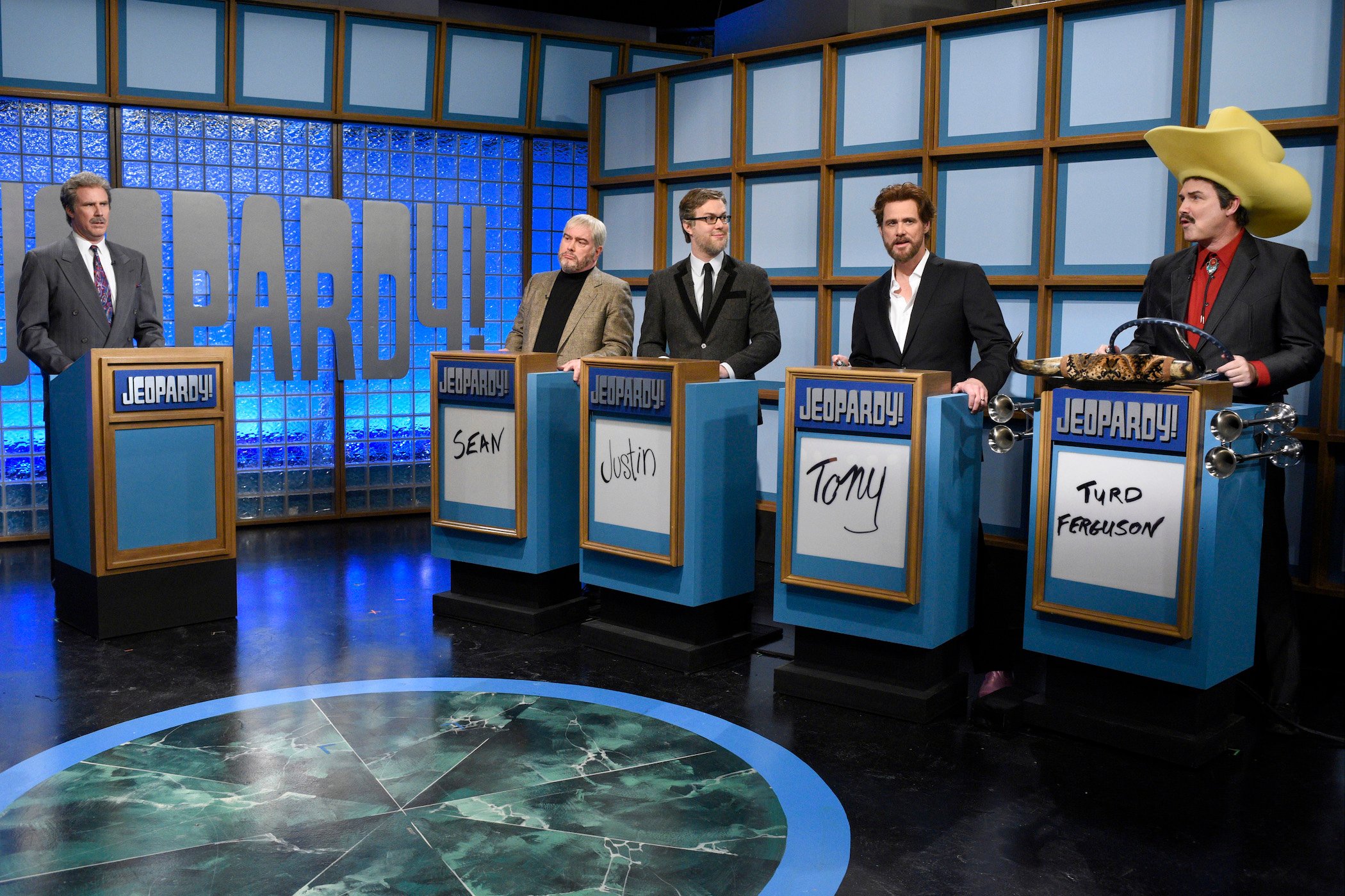 Will Ferrell as Alex Trebek in front of other comedians during the 'Celebrity Jeopardy!' skit. Norm Macdonald's Turd Ferguson on 'Jeopardy!' came from this skit