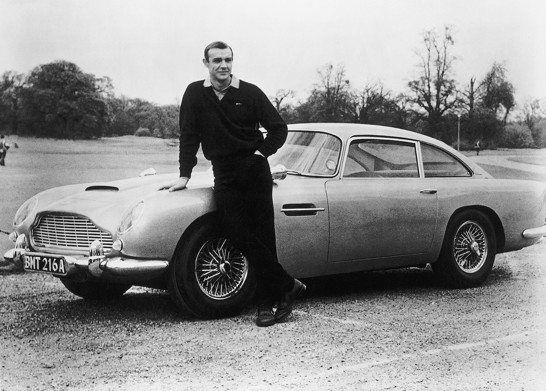 James Bond actor Sean Connery shows off his Aston Martin car