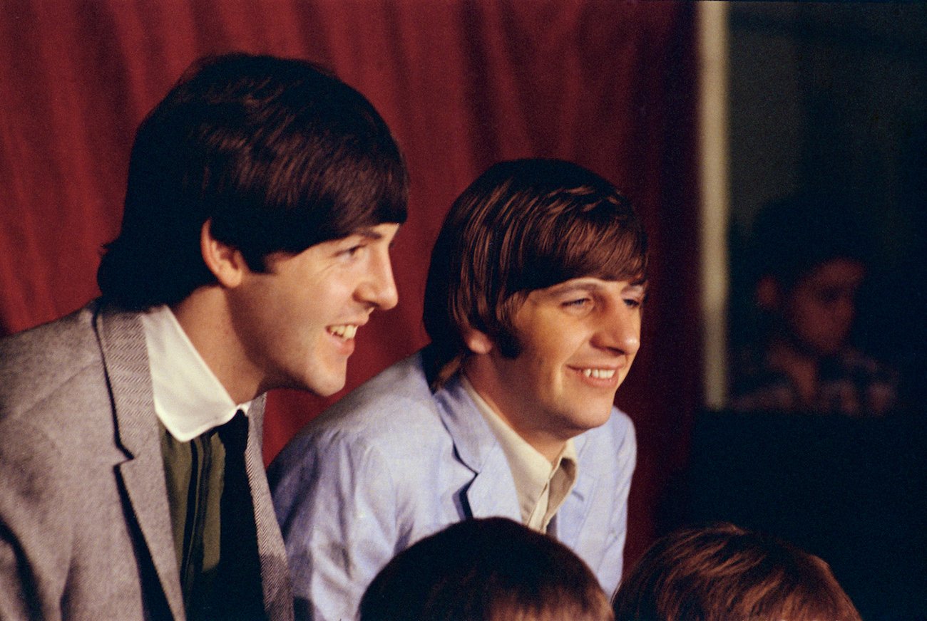 Paul McCartney and Ringo Starr laughing in 1965.