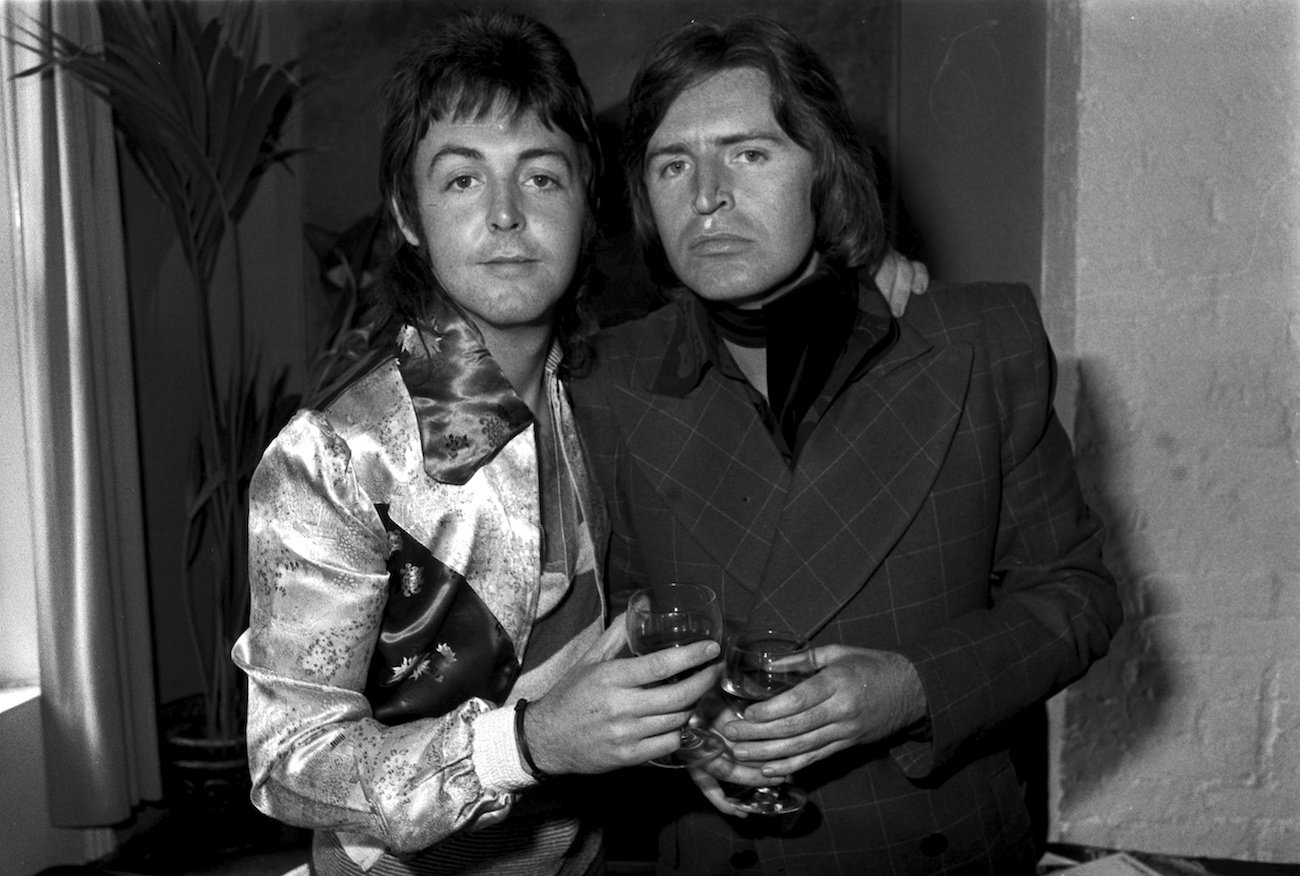 Paul McCartney and his brother Michael McGear in London, 1974.