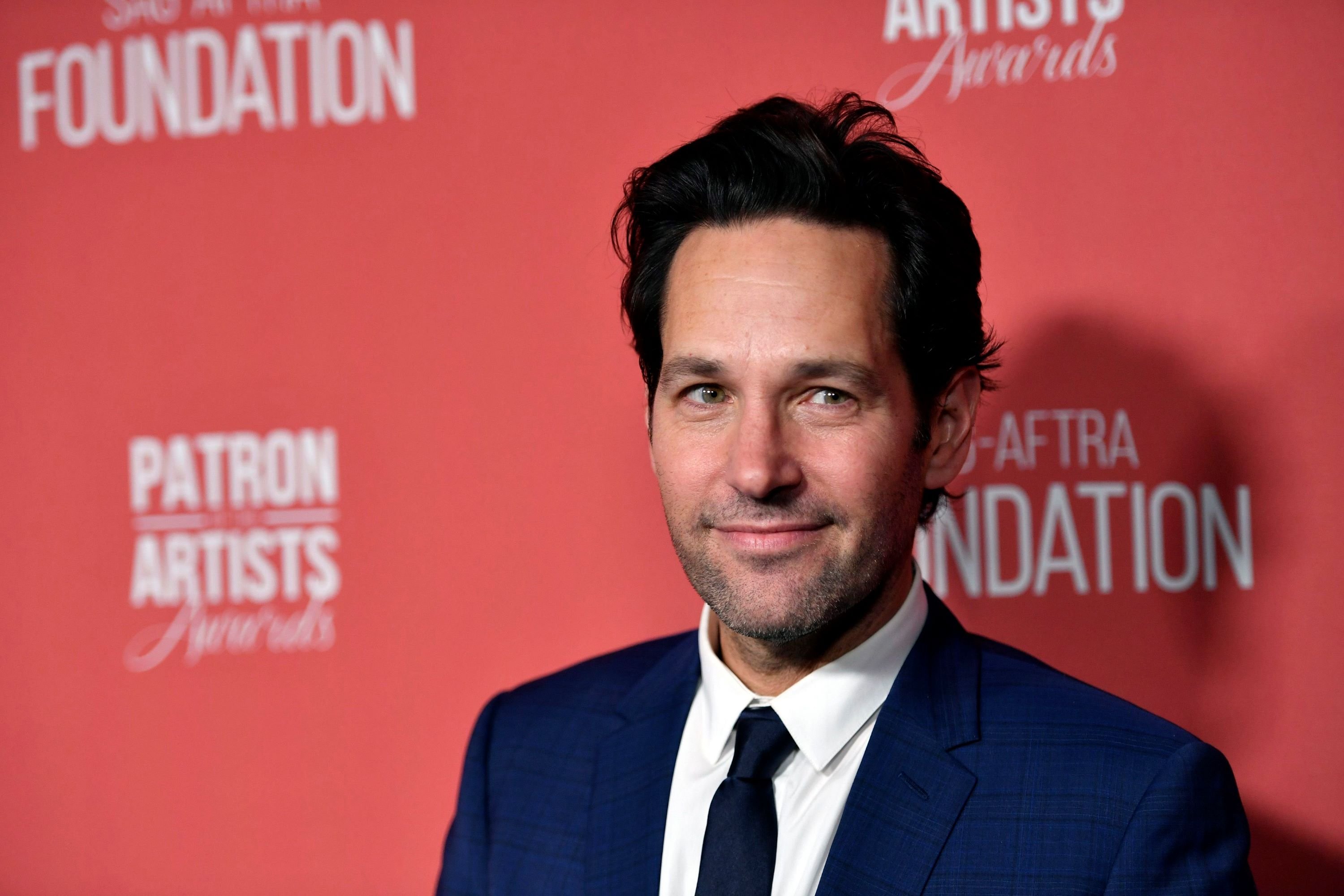 Paul Rudd smiles in blue jacket