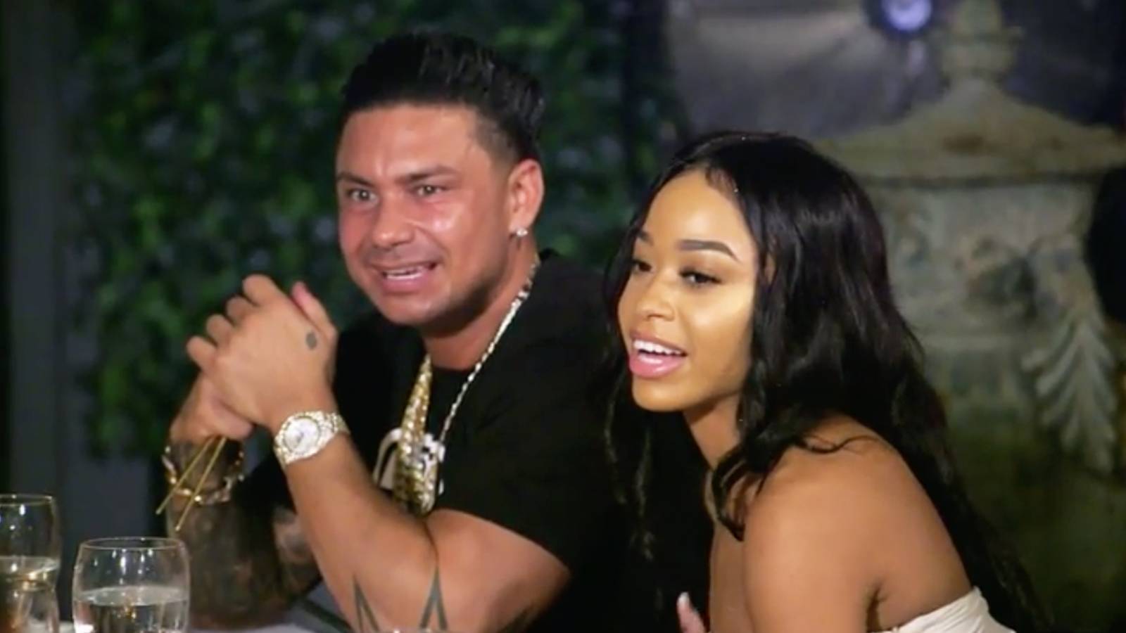 DJ Pauly D and Nikki Hall sit at a dinner table in 'Double Shot at Love' Season 2