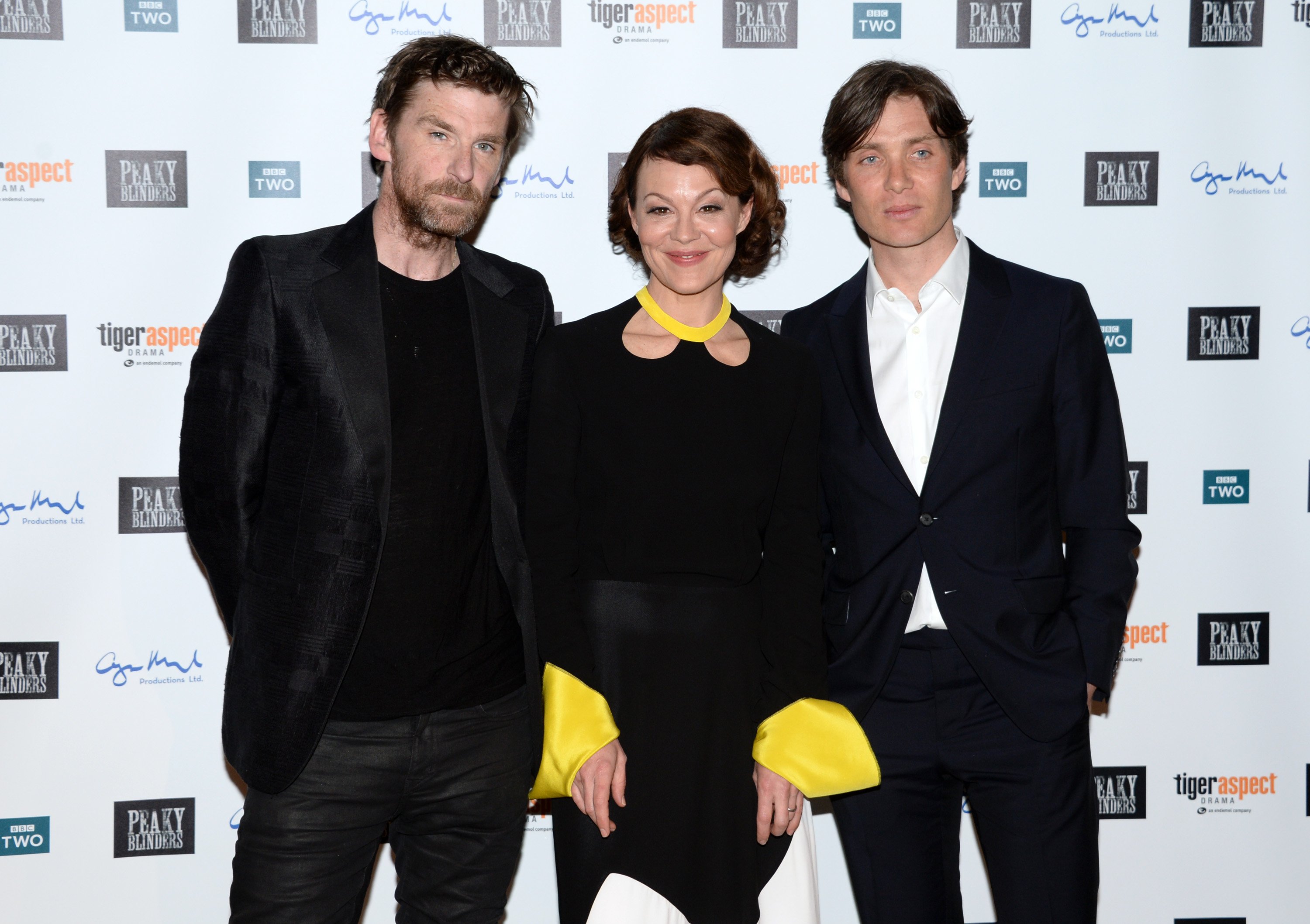 Paul Anderson, Helen McCrory, and Cillian Murphy pose for a photo at the premiere of 'Peaky Blinders' Season 3.