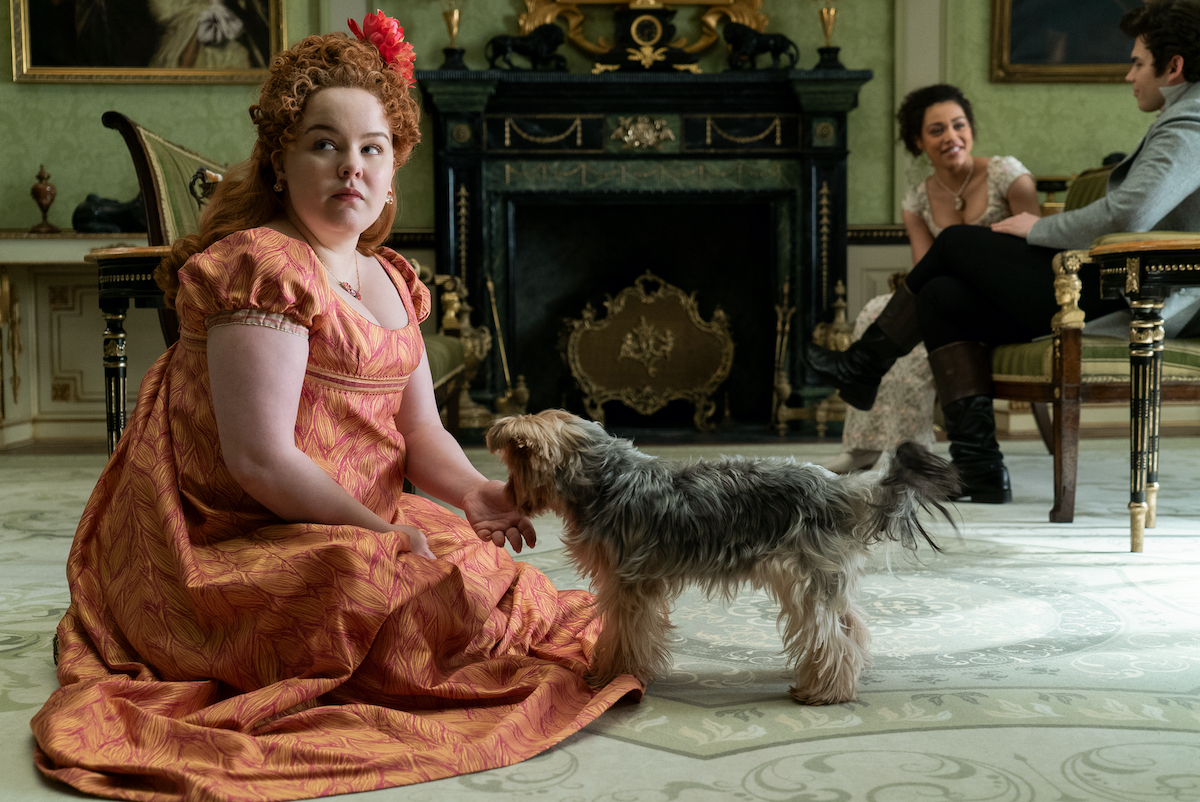 Nicola Coughlan in a coral dress as Penelope Featherington on 'Briderton'