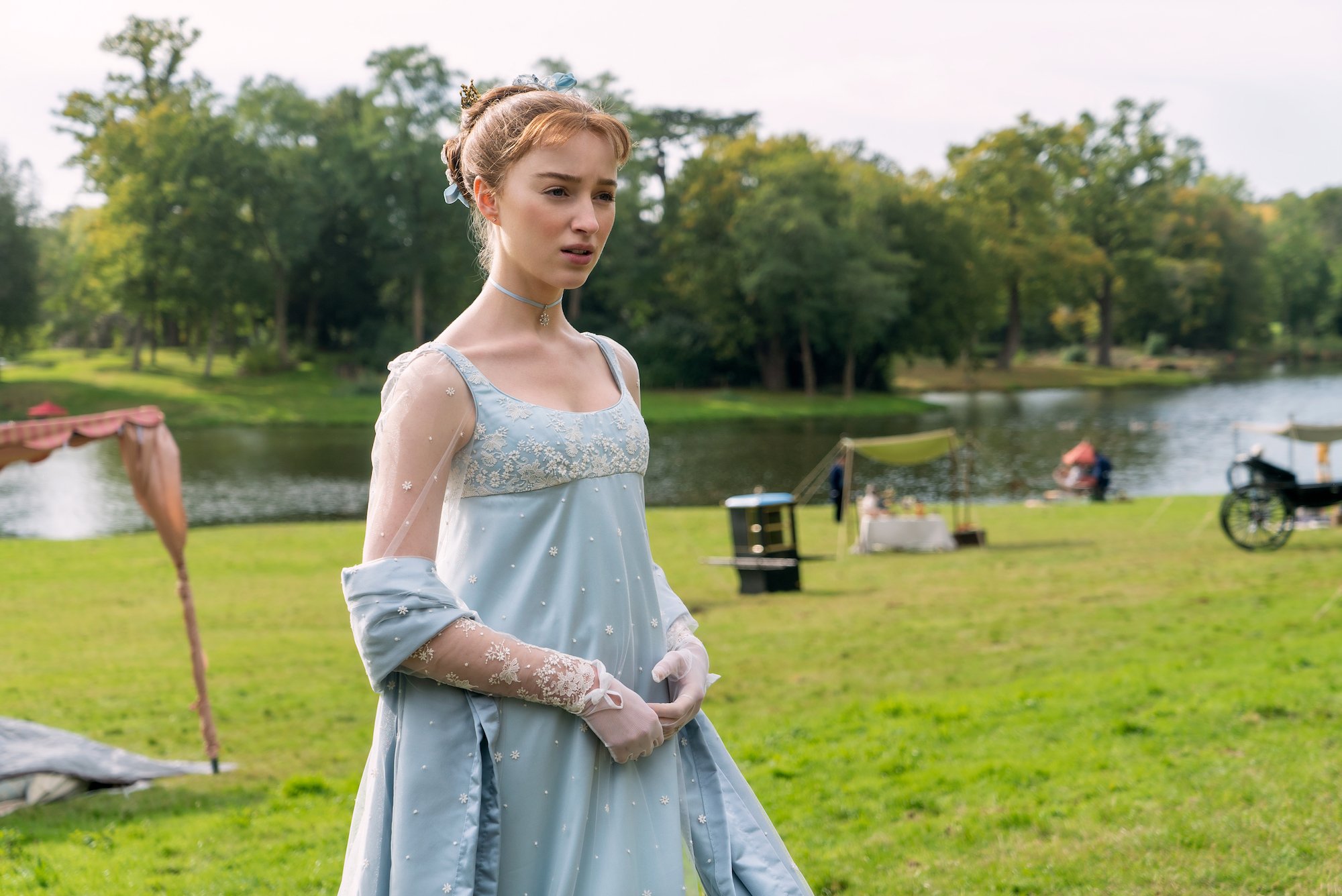 Phoebe Dynevor wearing a blue dress in 'Bridgerton' Season 1.