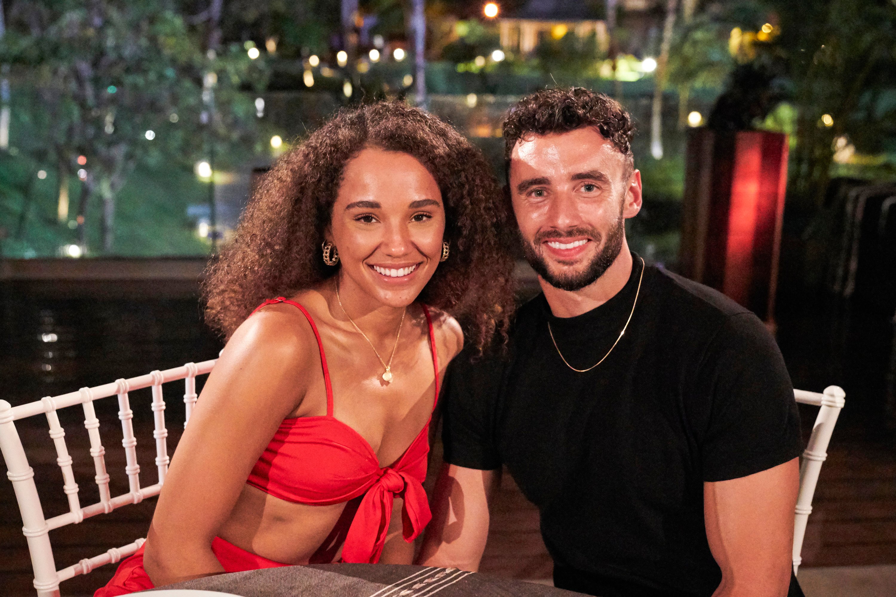 Pieper James in a red skirt and top and Brendan Morais in a black shirt on 'Bachelor in Paradise.'