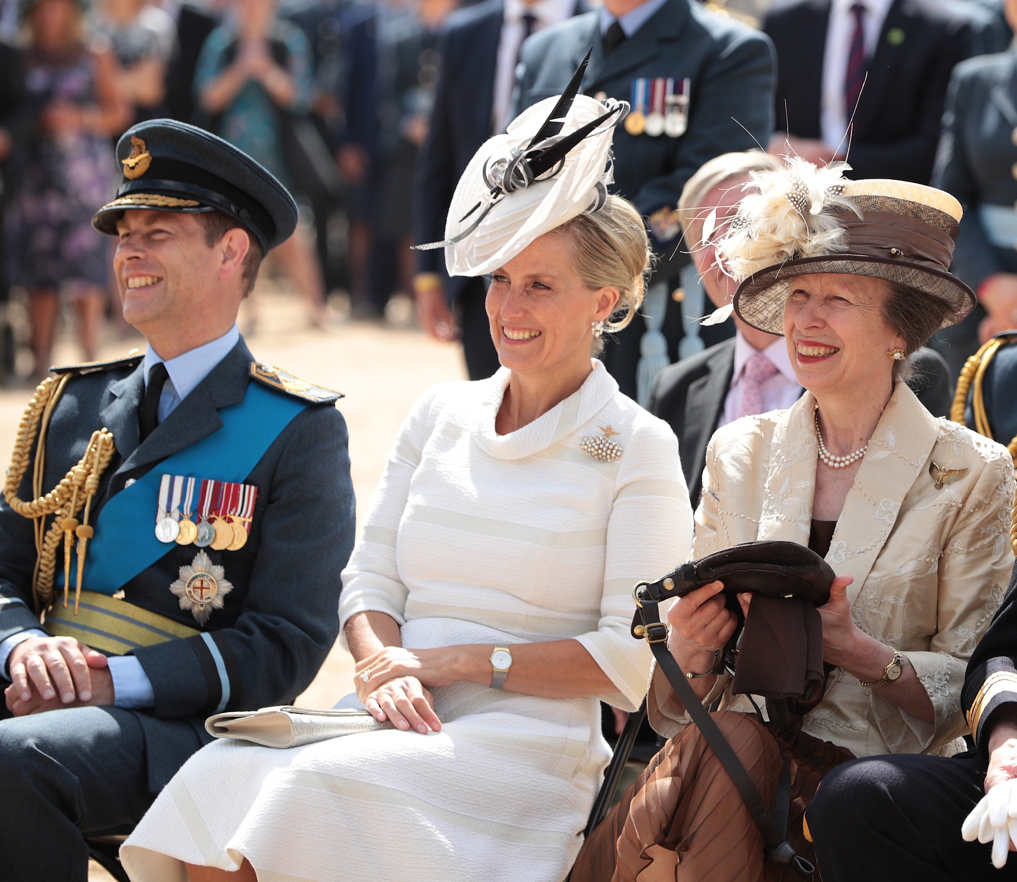 Prince Edward, Sophie Countess of Wessex ,and Princess Anne sitting next to each other at the RAF 100 ceremony