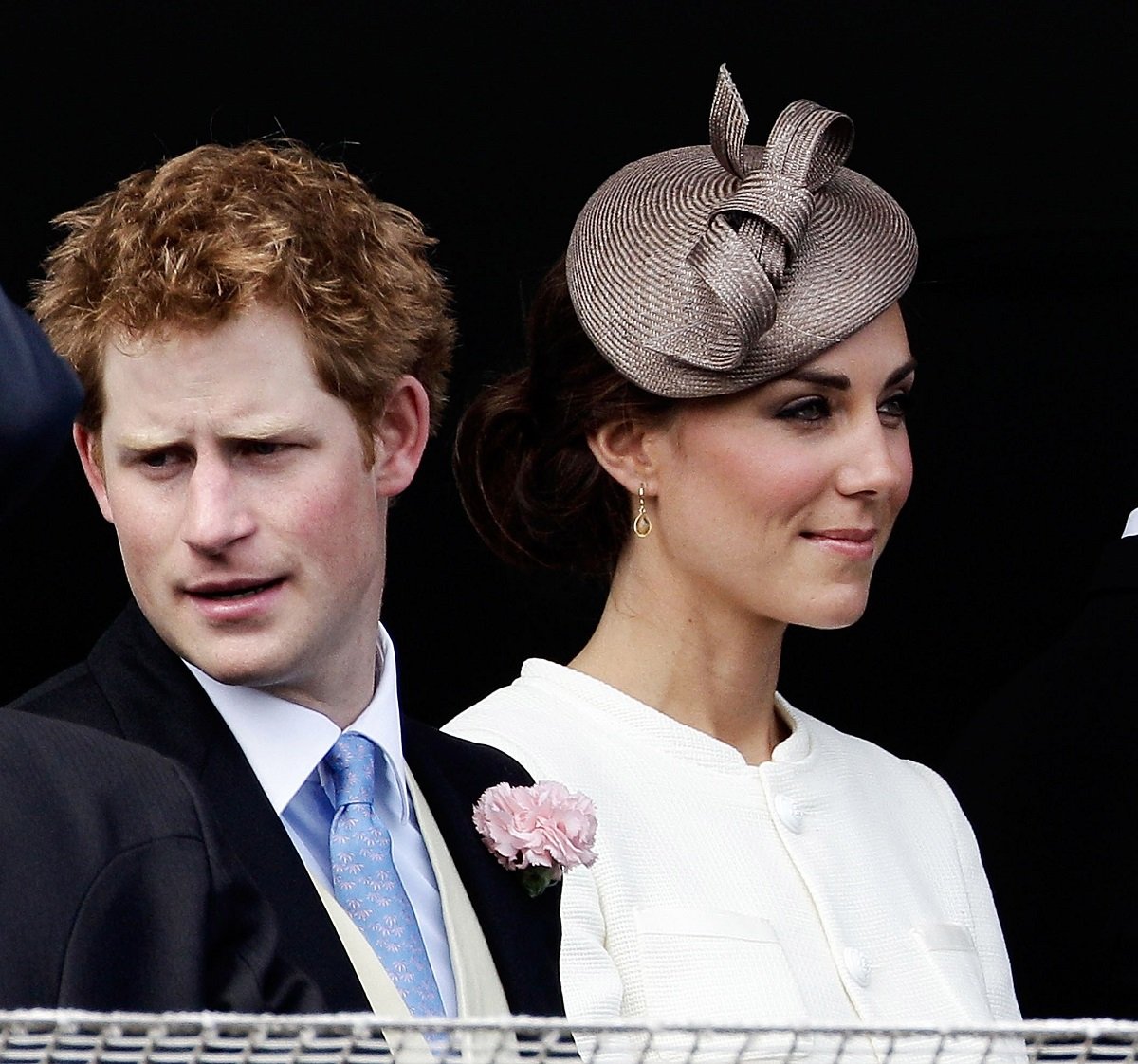 Prince Harry and Kate Middleton wait for the start of the Epsom Derby in 2011