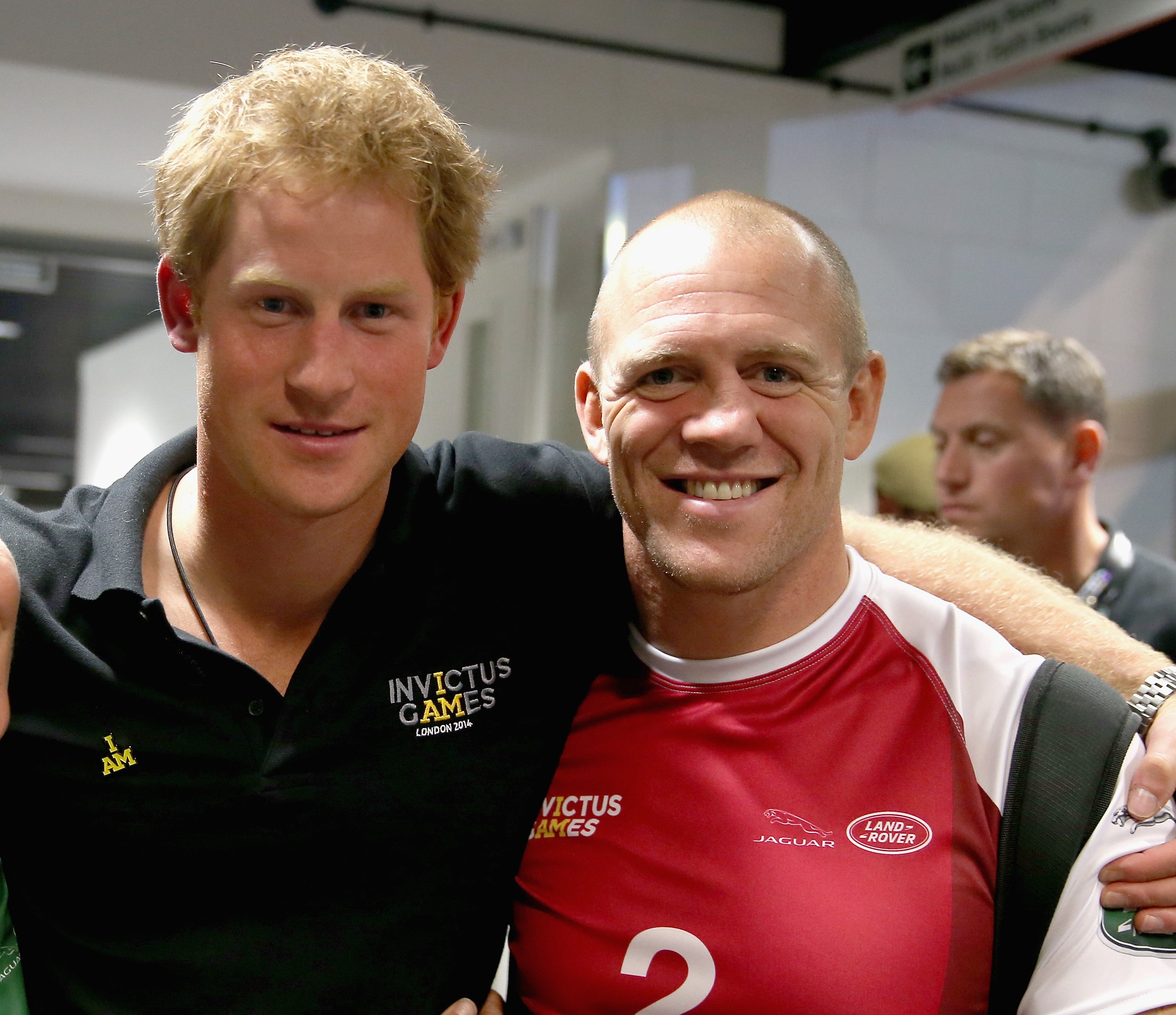 Prince Harry and Mike Tindall pose for a photograph after competing in an Exhibition wheelchair rugby match