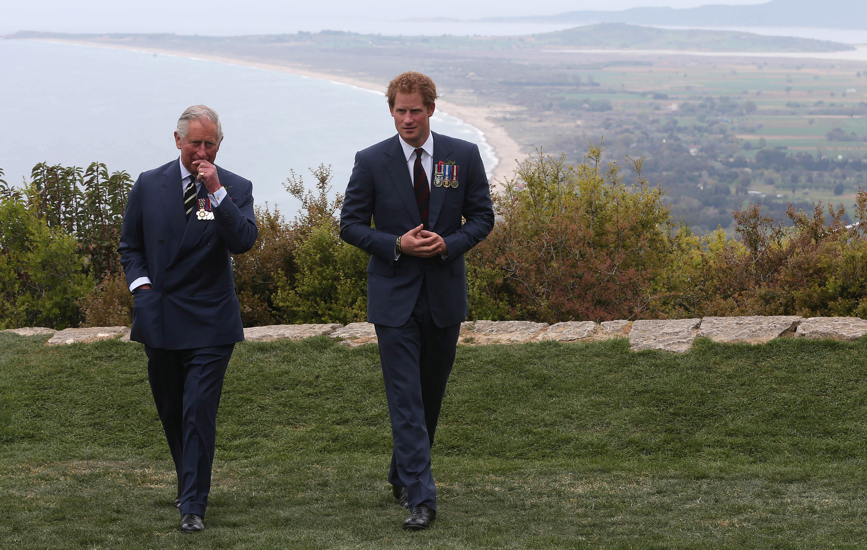Prince Harry walking and chatting with Prince Charles during a visit to The Nek