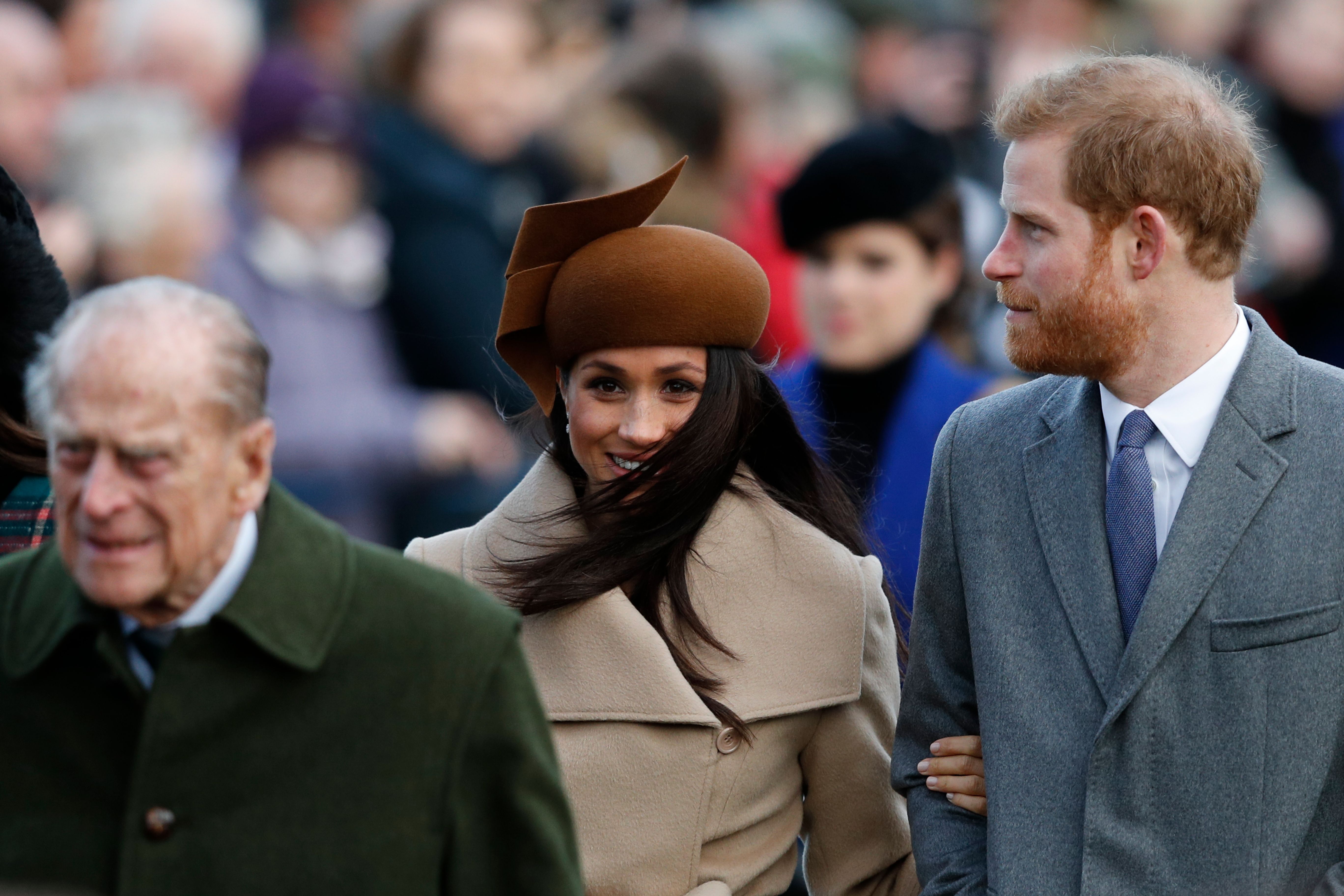 Prince Philip, Prince Harry, and Meghan Markle arriving to the royal family's Christmas Day church service