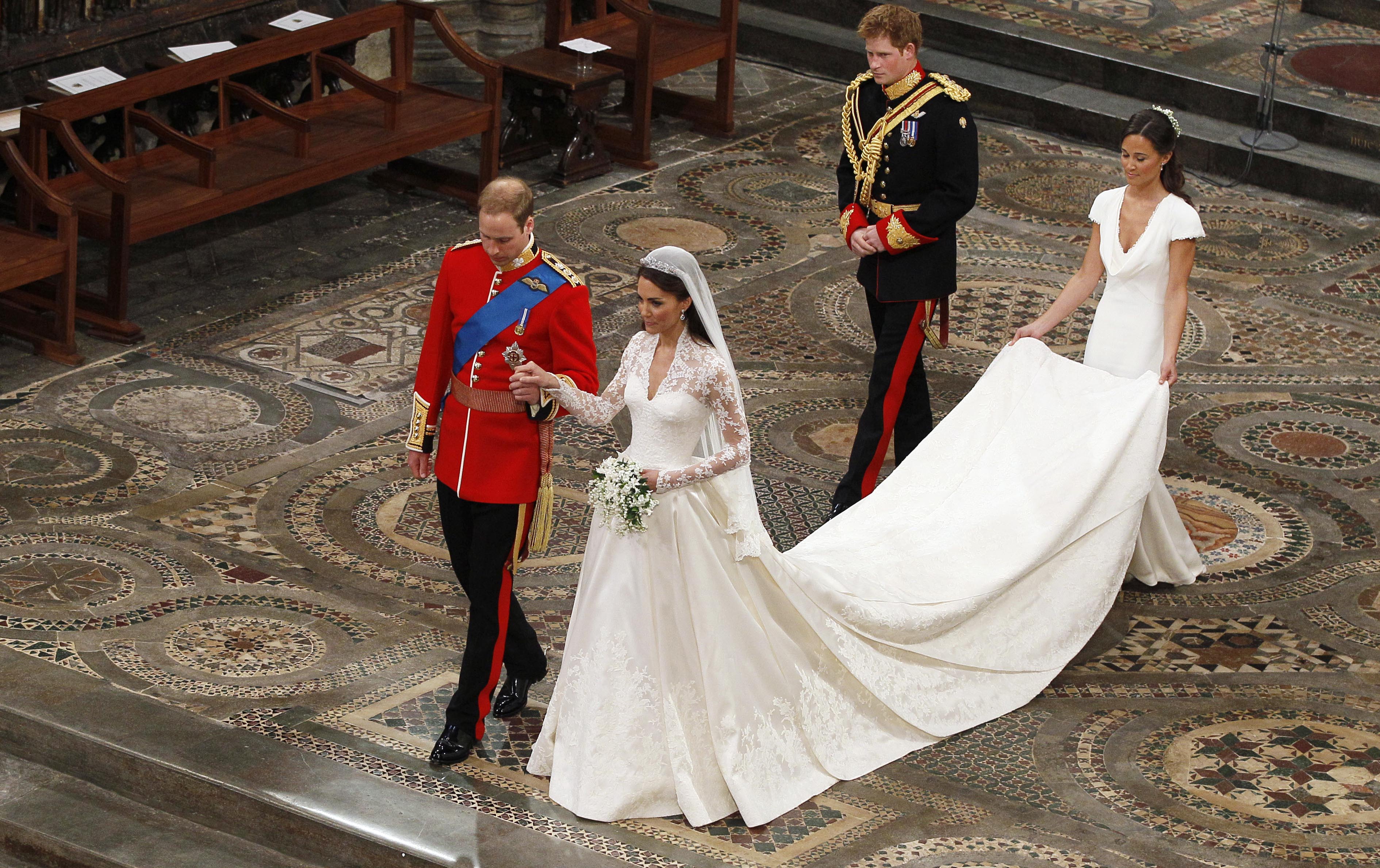 Prince William and Kate Middleton, followed by best man Prince Harry and maid of Honor Pippa Middleton leaving Westminster Abbey after wedding ceremony
