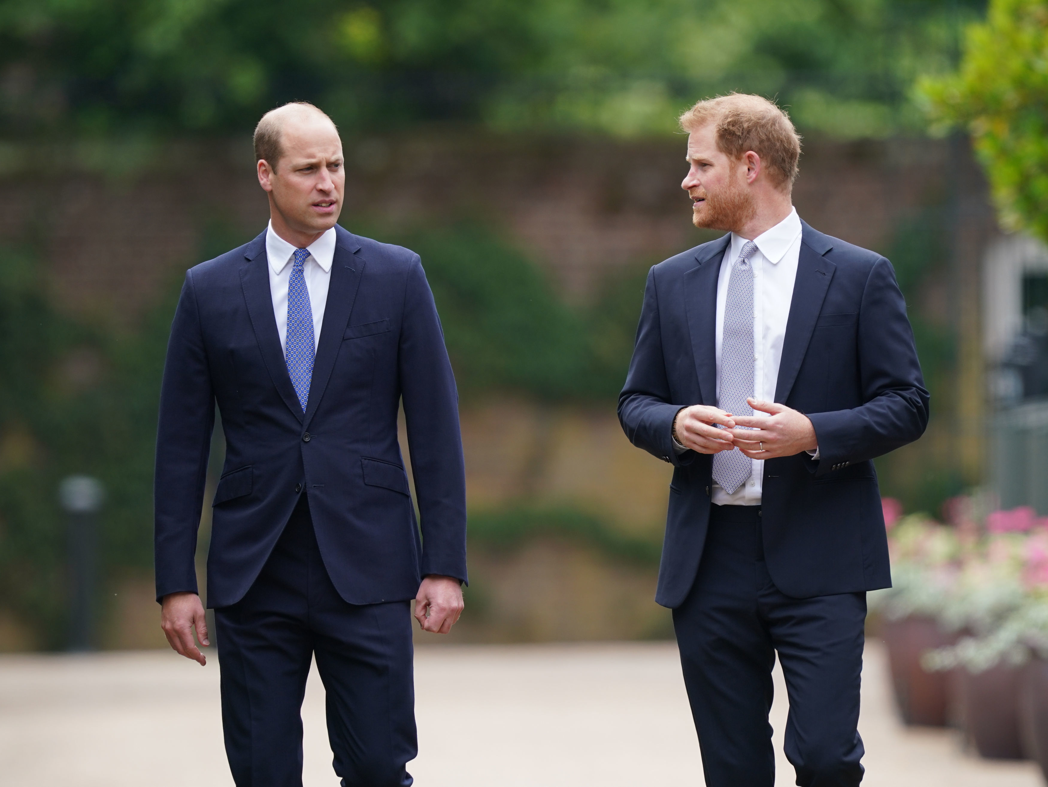 Prince William and Prince Harry arriving in the Sunken Garden at Kensington Palace for the unveiling of a statue of Princess Diana