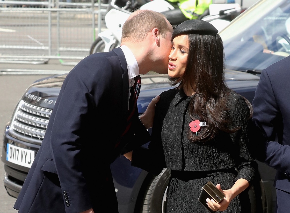 Prince William greeting Meghan Markle with a kiss on the cheek at Anzac Day Service of Commemoration and Thanksgiving