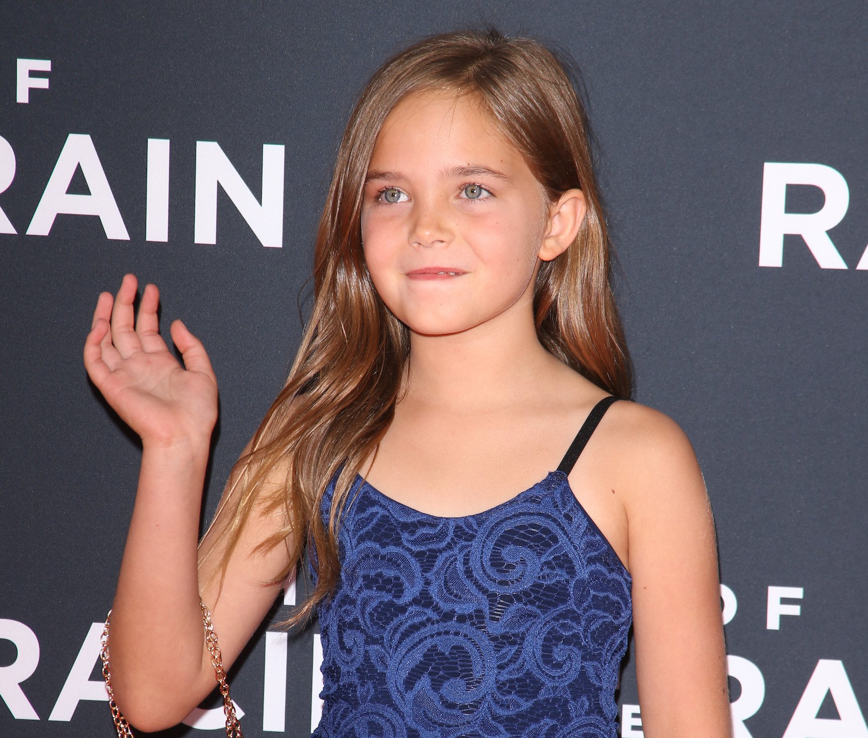 In 'American Horror Story' Season 10, Alma, played by Ryan Kiera Armstrong, is a major character. Here's Armstrong waving at an event.