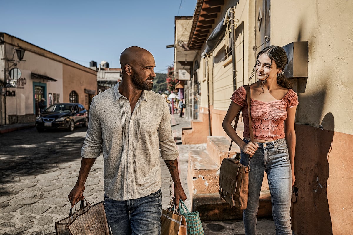 Shemar Moore and a woman walking down a street in Mexico in the 'S.W.A.T.' Season 5 premiere