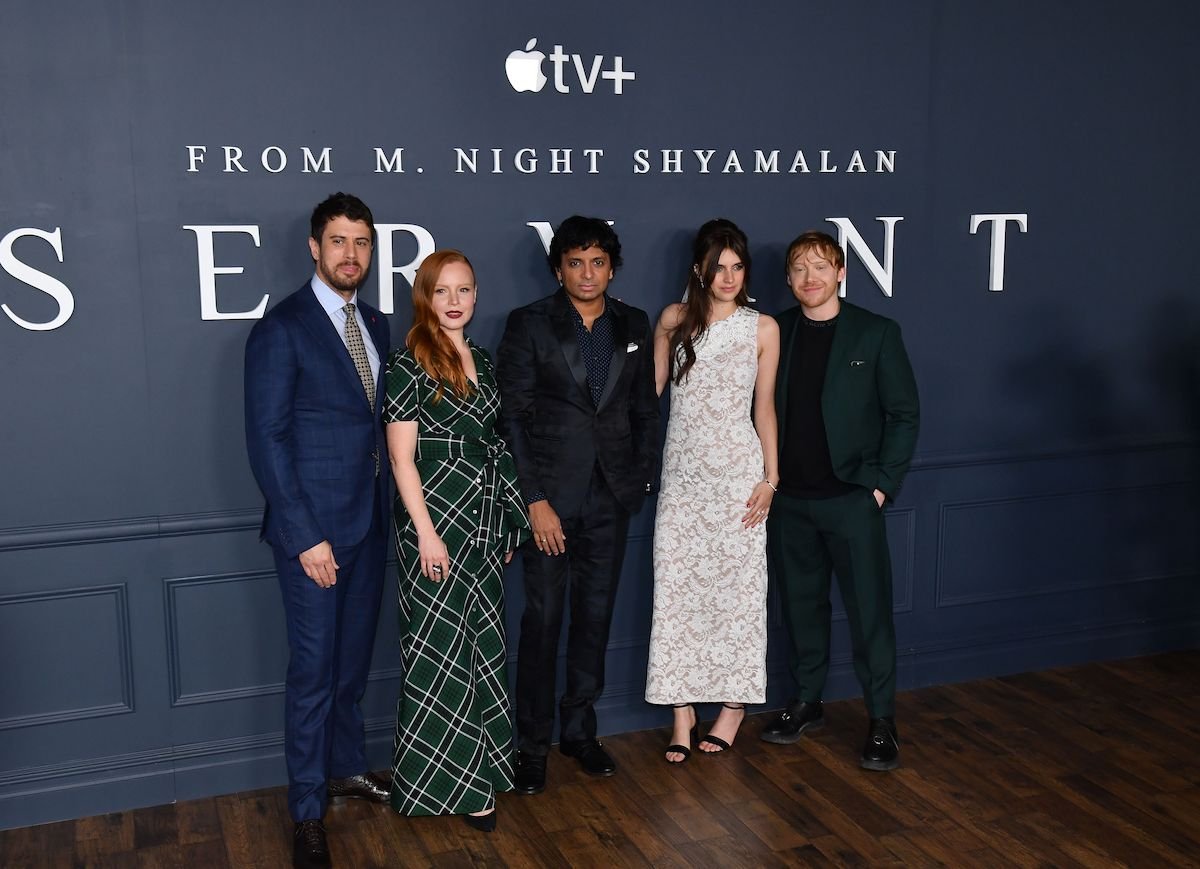 Toby Kebbell, Lauren Ambrose, M. Night Shyamalan, Nell Tiger Free, and Rupert Grint posing at an event for the horror series 'Servant'
