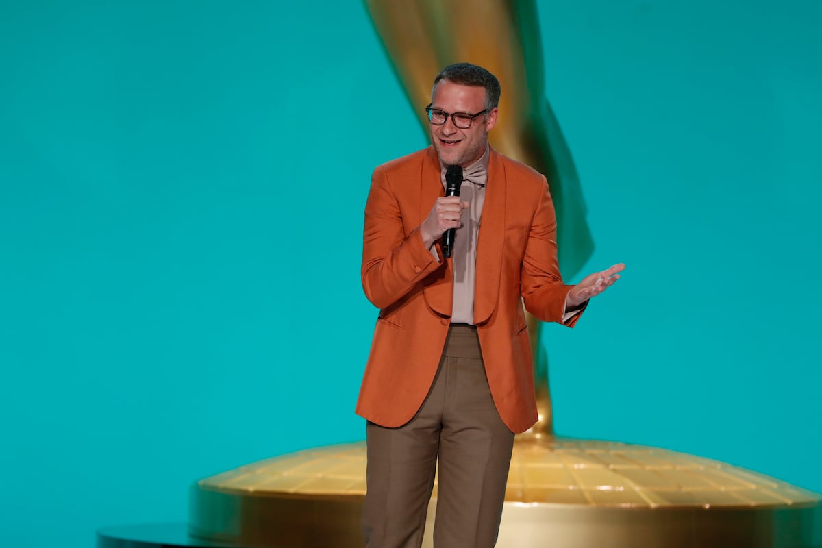 Seth Rogen on stage wearing an orange suit at the 2021 Emmys.