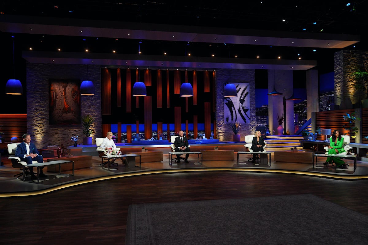 Shark Tank judges on a dimly lit set