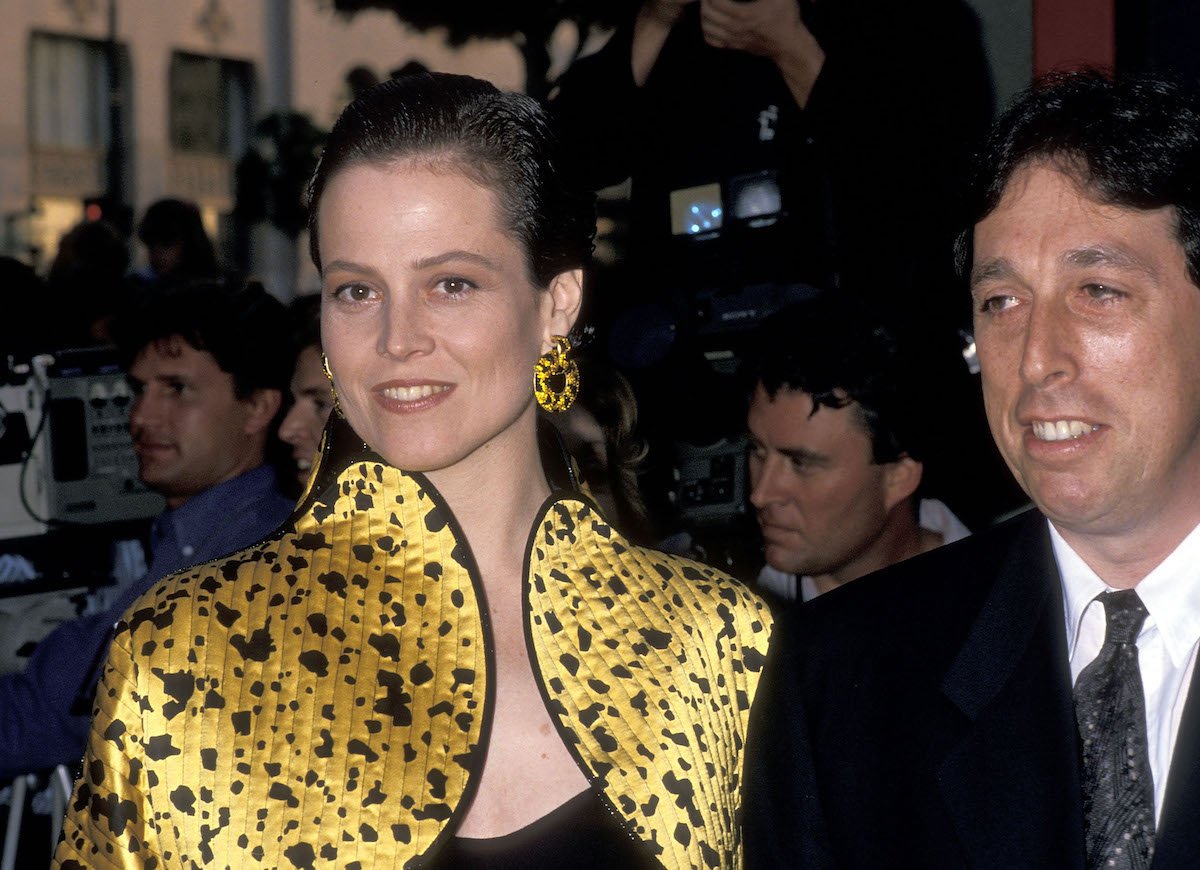 Sigourney Weaver in yellow and Ivan Reitman at 'Ghostbusters II' premiere