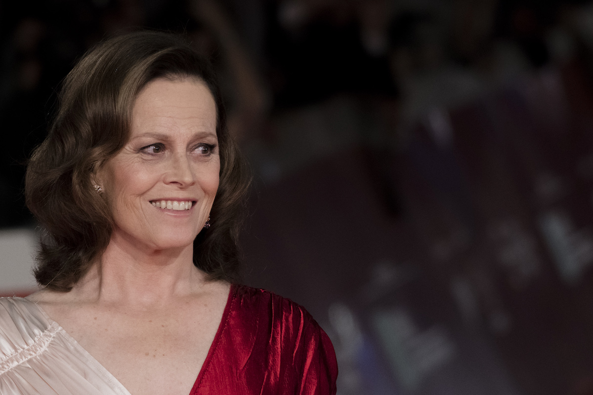 Sigourney Weaver of 'Ghostbusters' in a red and cream dress