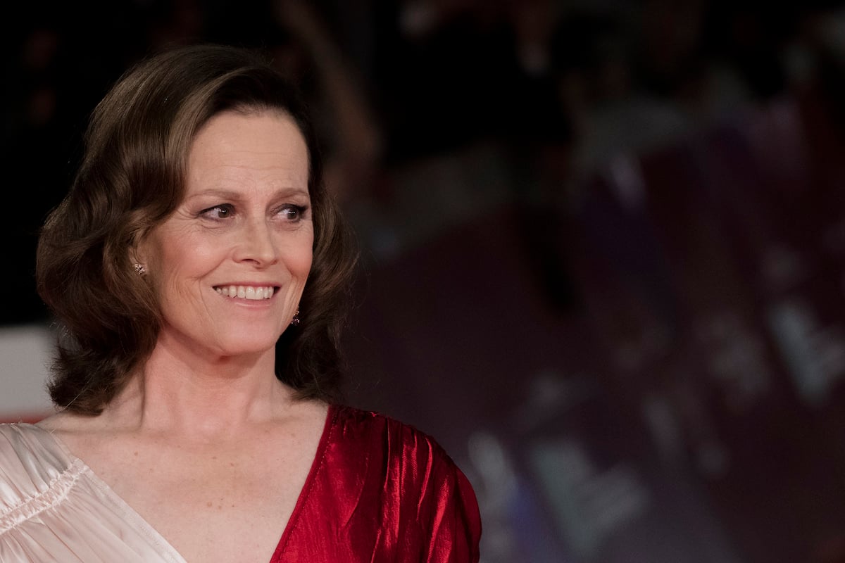 Sigourney Weaver of 'Ghostbusters' in a red and cream dress