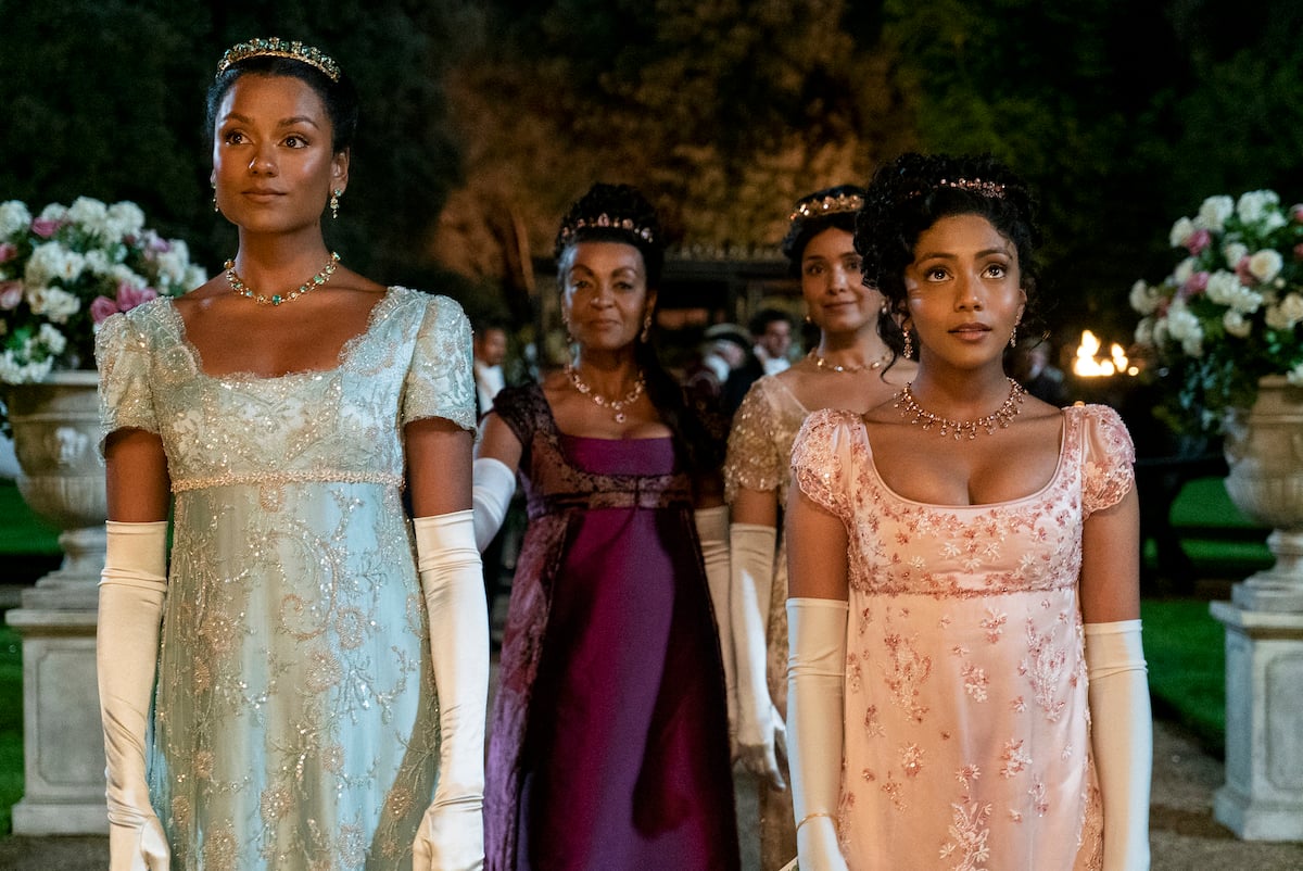 Simone Ashley, Adjoa Andoh, Shelley Conn, and Charithra Chandran wearing dresses to a ball in 'Bridgerton' Season 2.