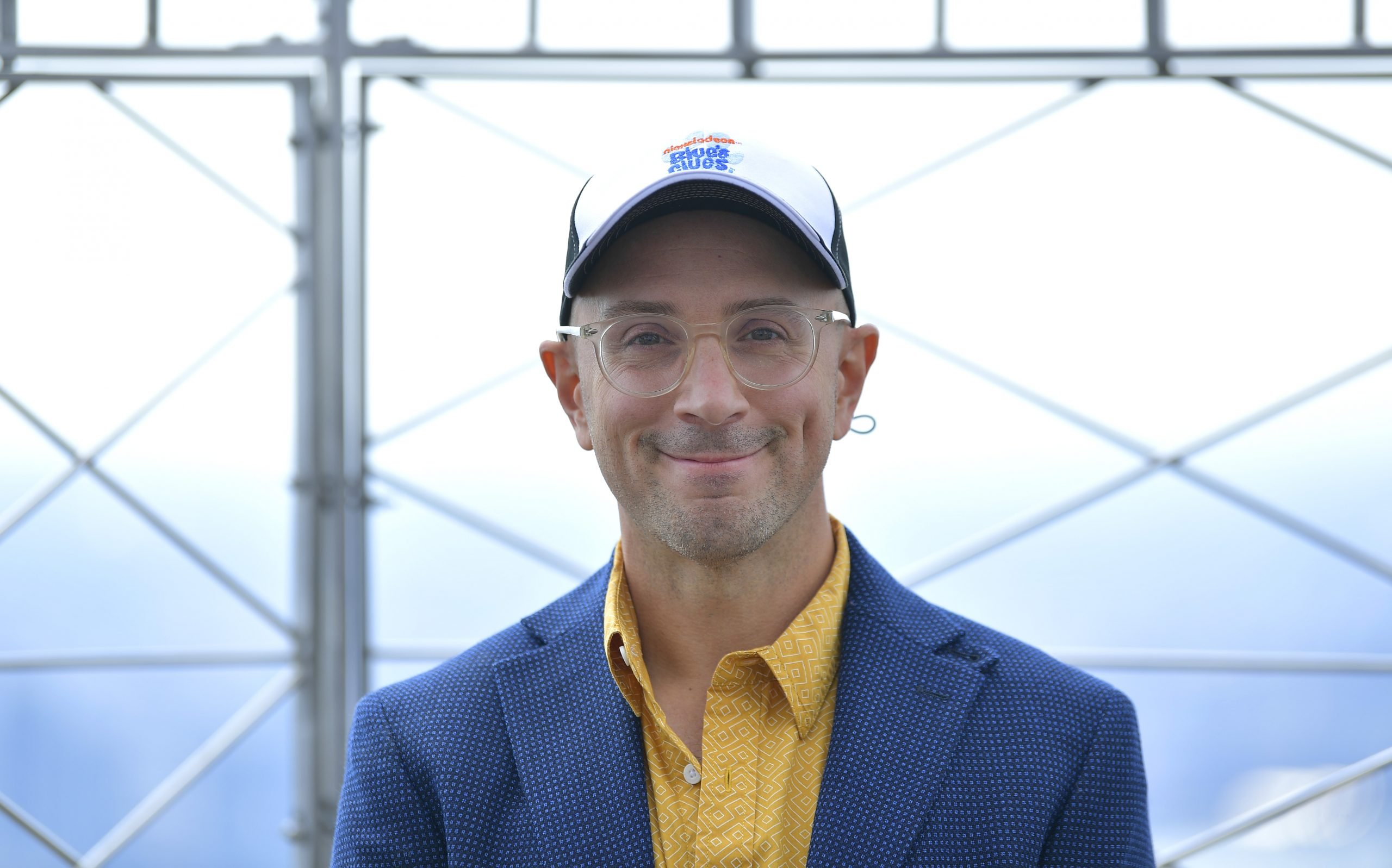 Steve Burns poses for a photo in the observatory as he and Josh Dela Cruz light the Empire State Building blue in celebration of 'Blue's Clues' 25th Anniversary