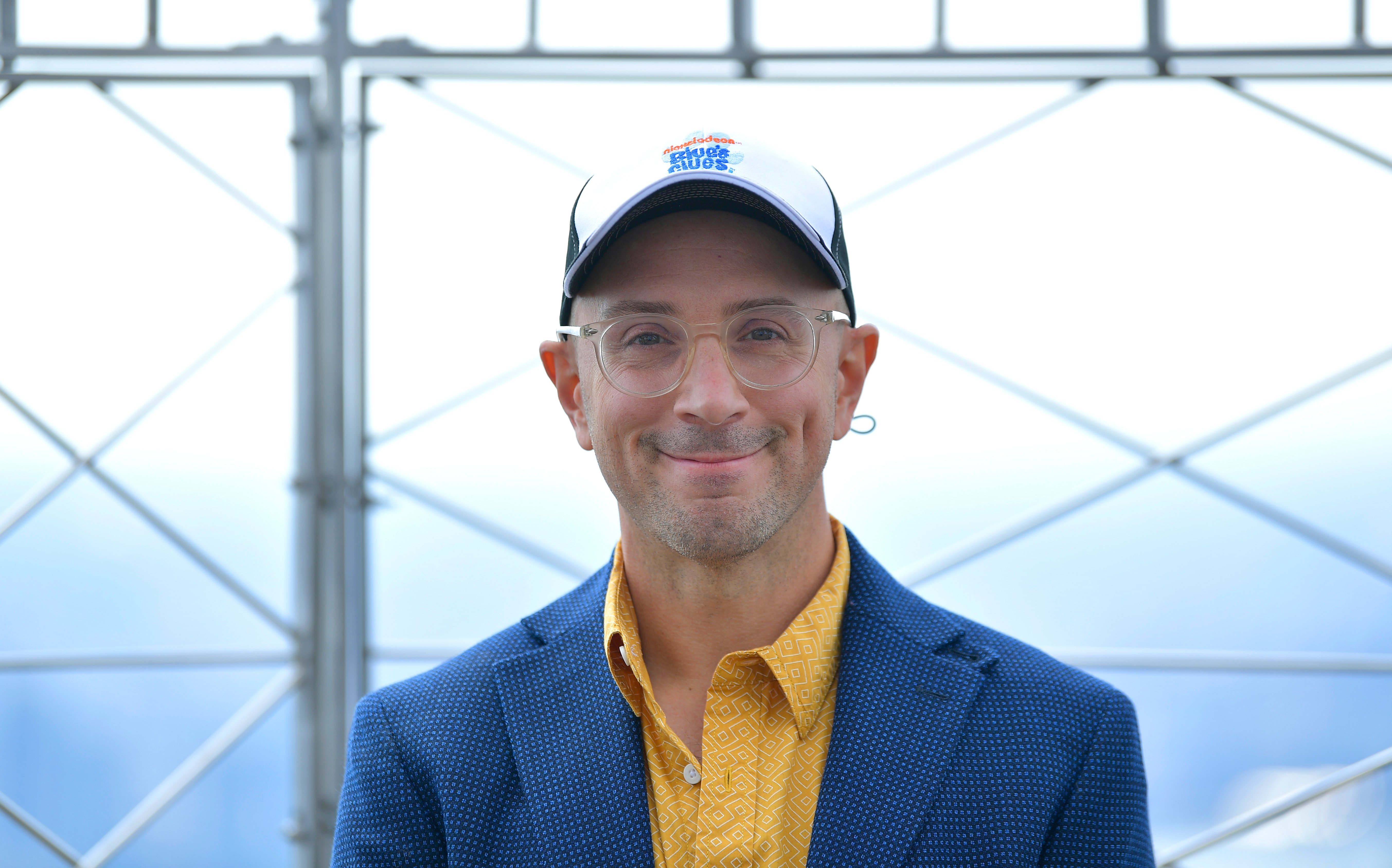 Steve Burns poses for a photo in the observatory as he and Josh Dela Cruz light the Empire State Building blue in celebration of 'Blue's Clues' 25th Anniversary