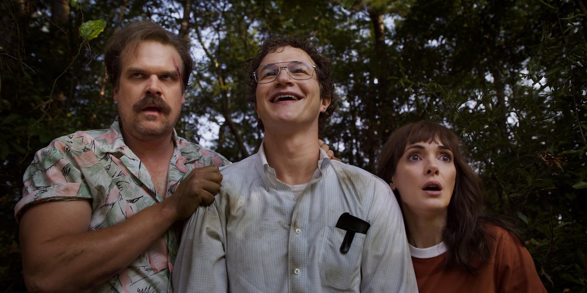 Hopper, Alexei, and Joyce in a still from 'Stranger Things' Season 3