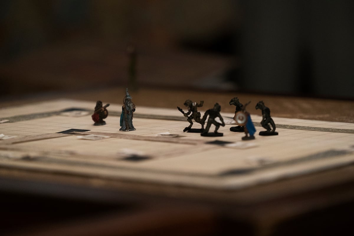 Dungeons and Dragon pieces on the game board in a production still from 'Stranger Things' Season 1. Will the monster make a return in 'Stranger Things' Season 4?