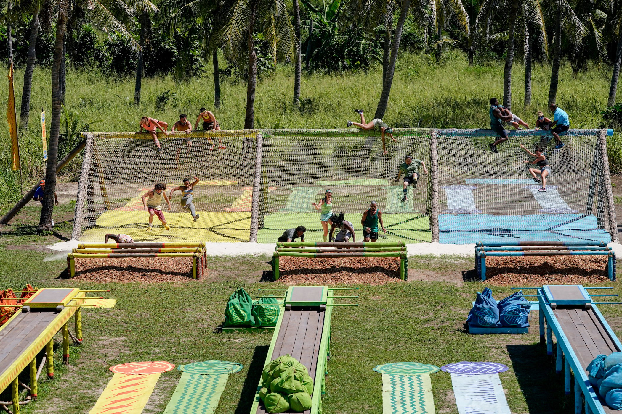 The 'Survivor' Season 41 cast participating in a challenge where they're jumping over nets