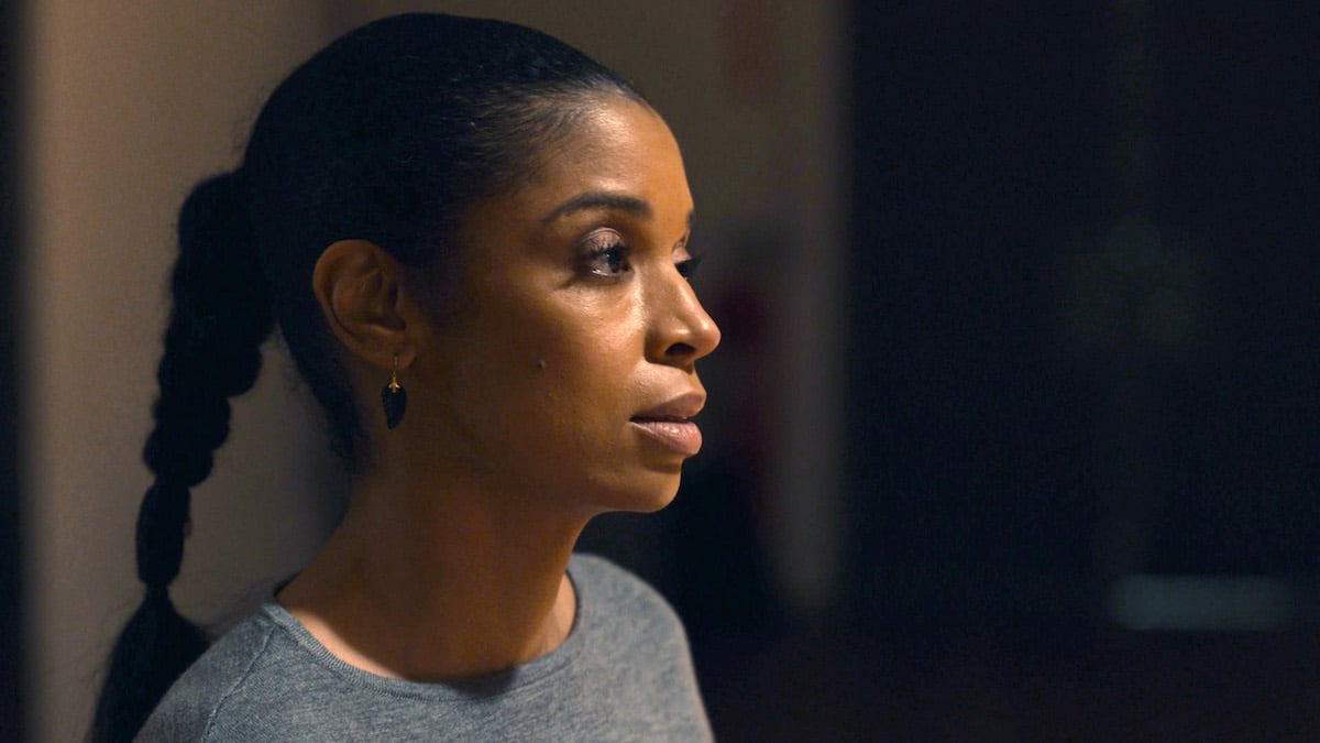 Susan Kelechi Watson as Beth on 'This Is Us' stares off into space wearing a ponytail.