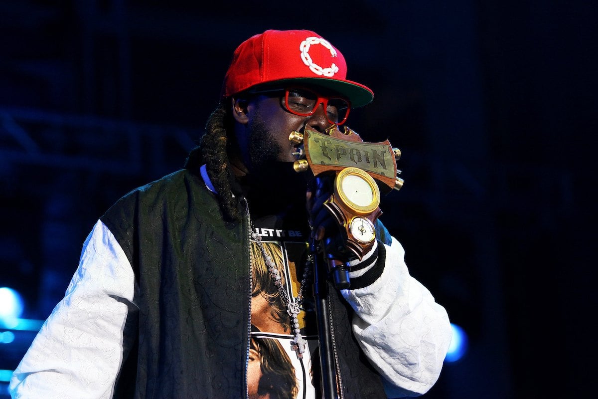 T-Pain wears a black and white jacket and a red hat as he performs during the B96 Pepsi Summerbash at Toyota Park in Bridgeview, Illinois on June 11, 2011.