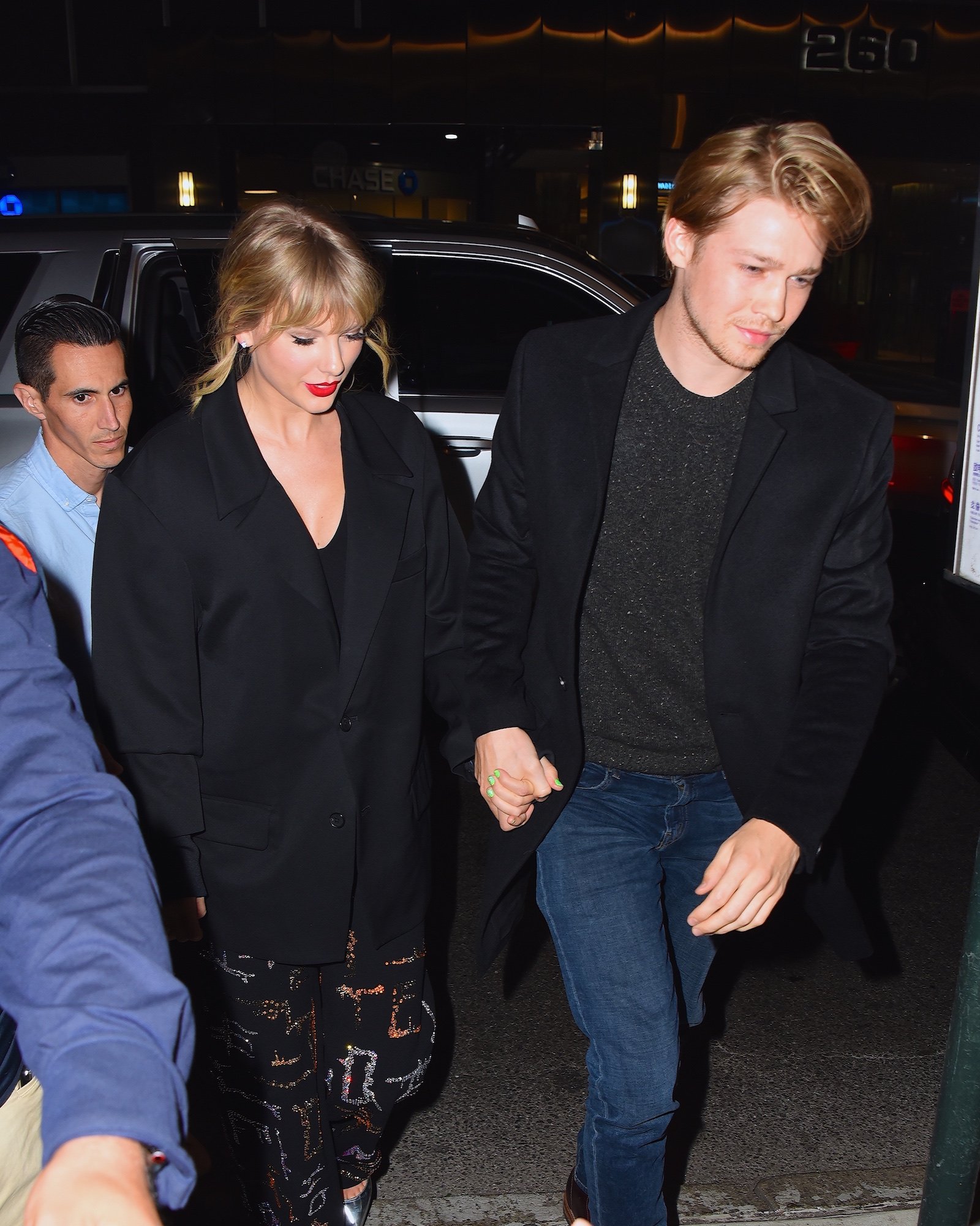 Taylor Swift and Joe Alwyn holding hands while walking in New York City