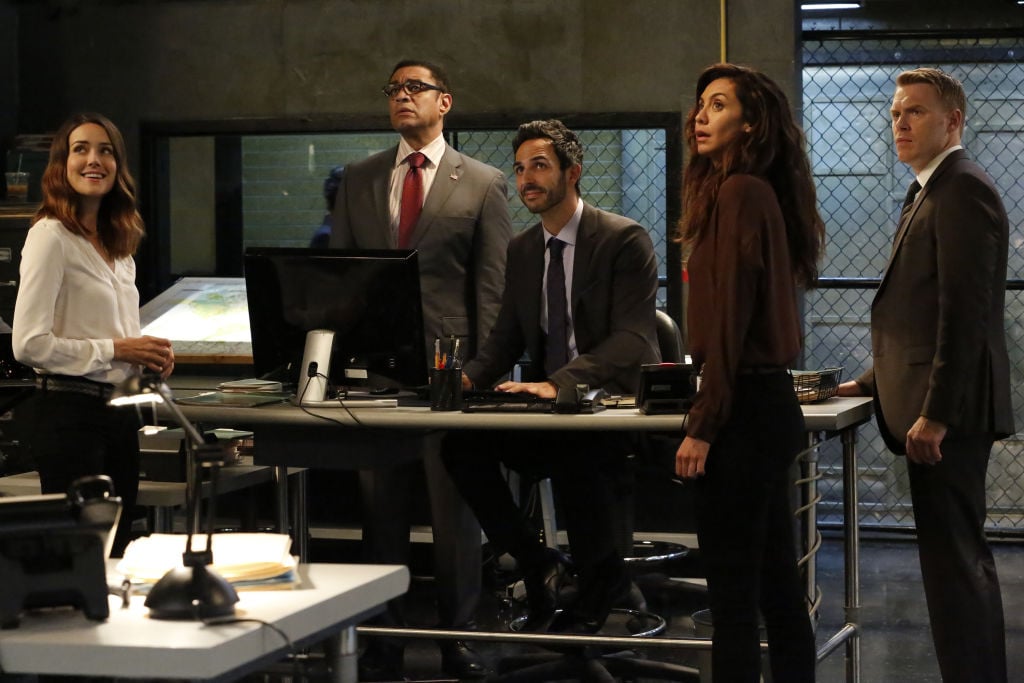 Megan Boone as Elizabeth Keen, Harry Lennix as Harold Cooper, Amir Arison as Aram Mojitabai, Mozhan Marnò as Samar Navabi, Diego Klattenhoff as Donald Ressler stand in the FBI task force headquarters.