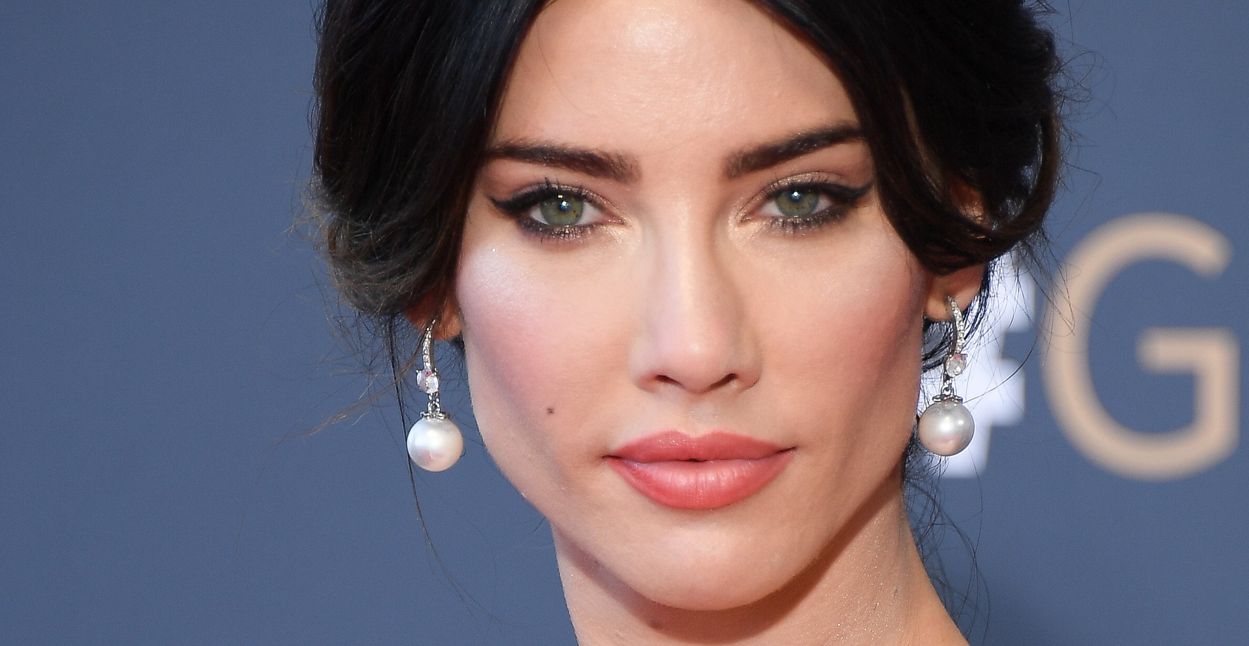 The Bold and the Beautiful speculation focuses on Steffy, who is pictured here in a headshot wearing drop-down pearl and diamond earrings and an upswept hairdo