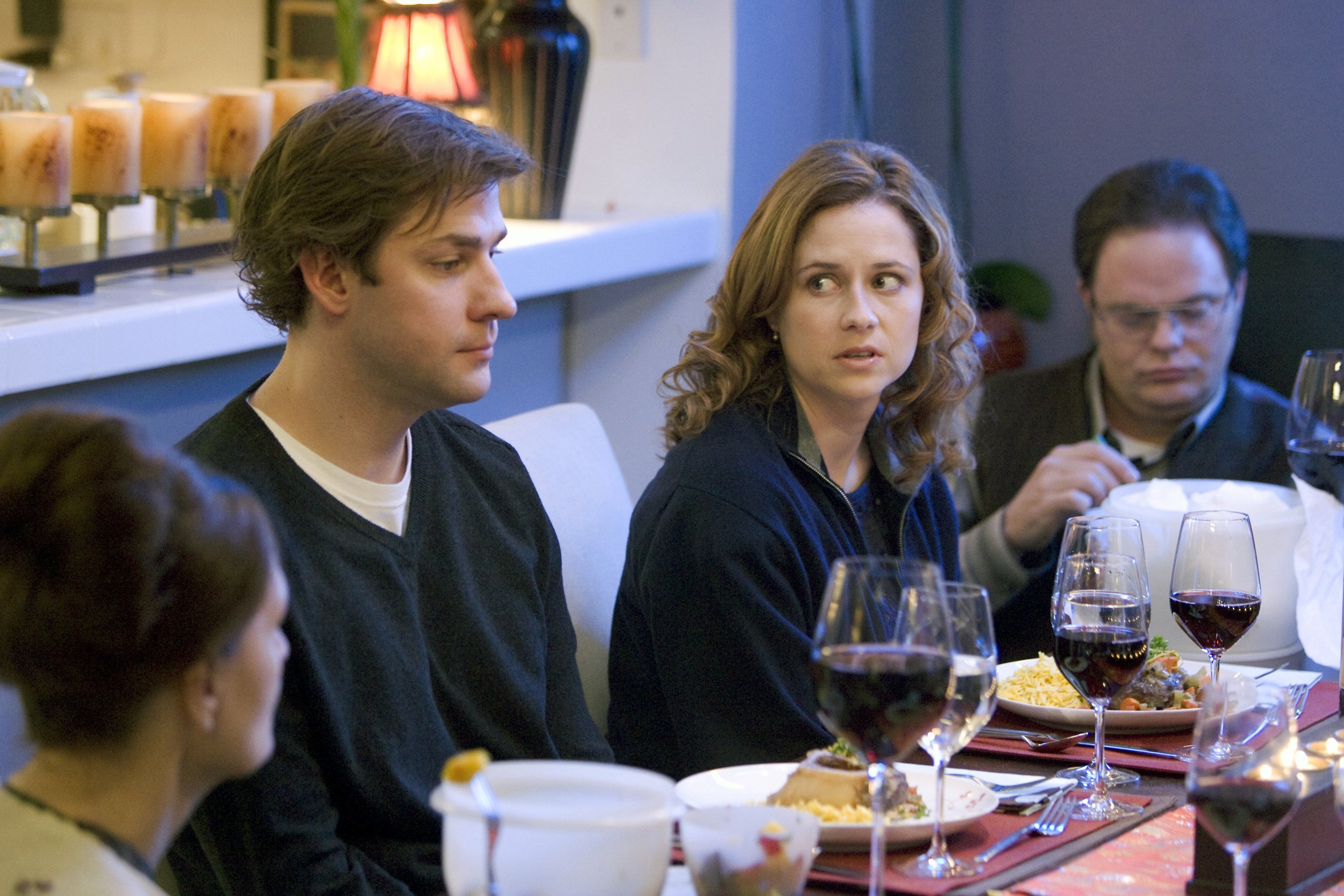 John Krasinski as Jim Halpert, Jenna Fischer as Pam Beesly, Rainn Wilson as Dwight Schrute at the dining room table in 'The Office' episode 'The Dinner Party'