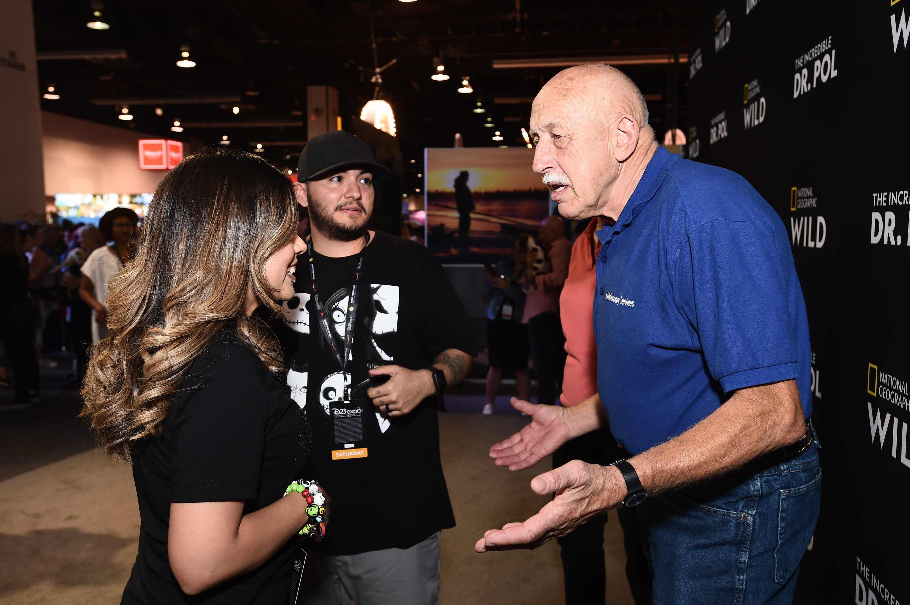 Dr. Jan Pol, right, of 'The Incredible Dr. Pol' greets fans in 2019.