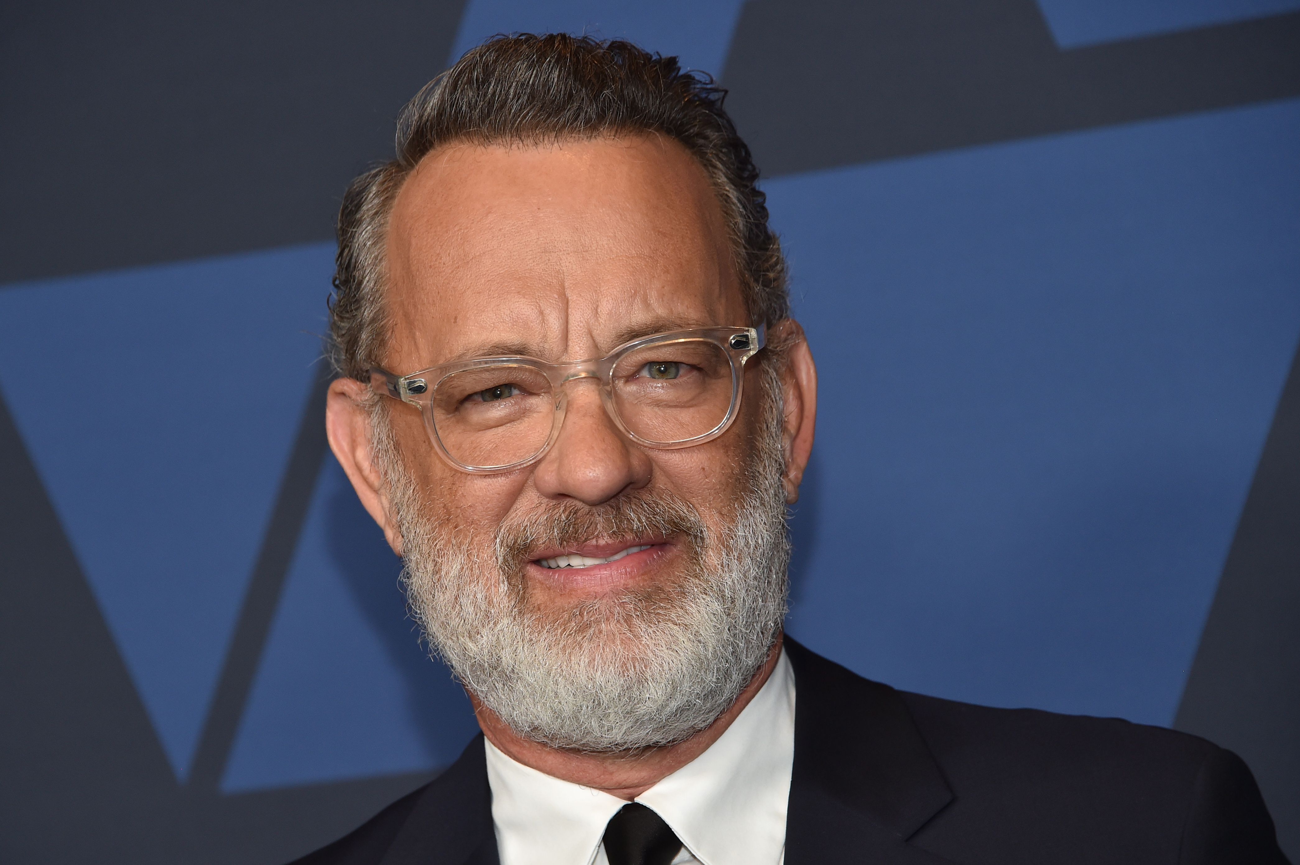 Tom Hanks, in a black suit and sporting a white beard, at the Governor's Awards Gala in 2019.