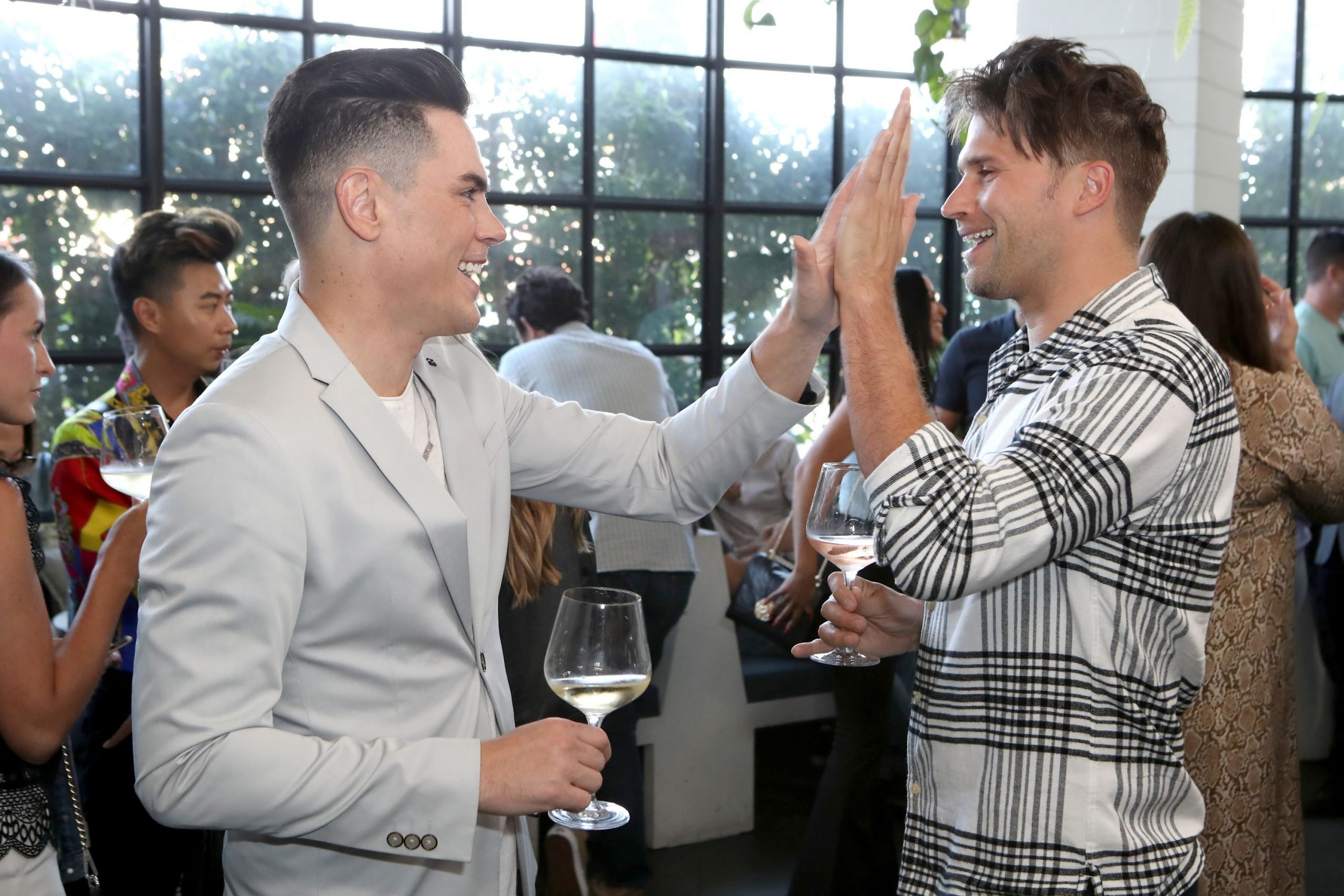 Tom Sandoval high fives Tom Schwartz